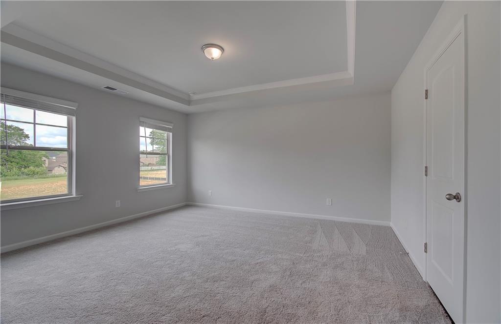 116 Haverling Pass Hampton, GA 30228 - Photo 23 of 38 an empty room with windows