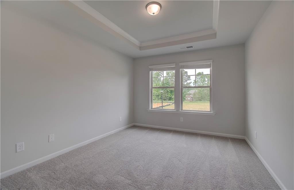 116 Haverling Pass Hampton, GA 30228 - Photo 26 of 38 an empty room with a window