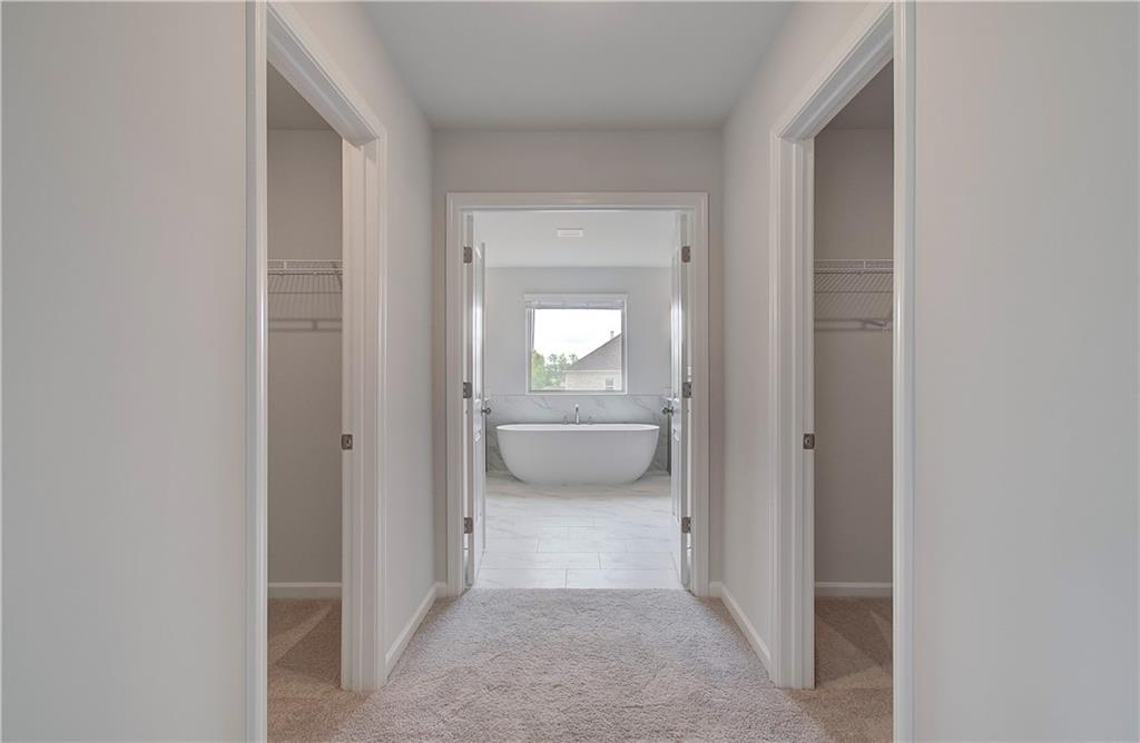 116 Haverling Pass Hampton, GA 30228 - Photo 30 of 38 a view of a hallway with a bathroom