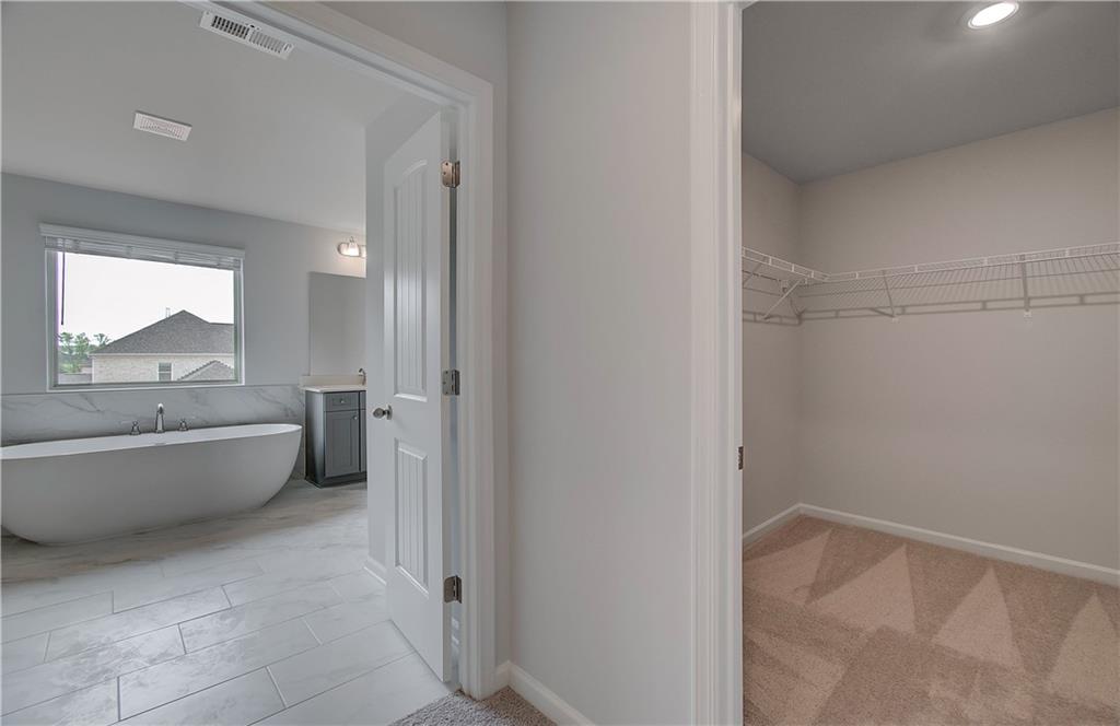 116 Haverling Pass Hampton, GA 30228 - Photo 31 of 38 a bathroom with a bathtub and toilet