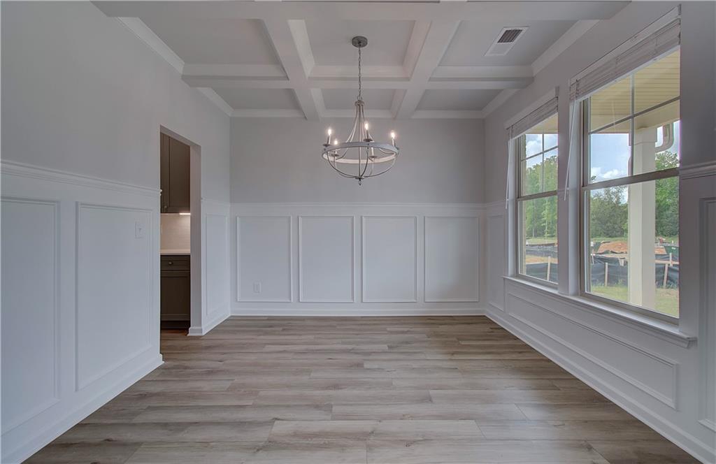 116 Haverling Pass Hampton, GA 30228 - Photo 8 of 38 wooden floor in an empty room with a window