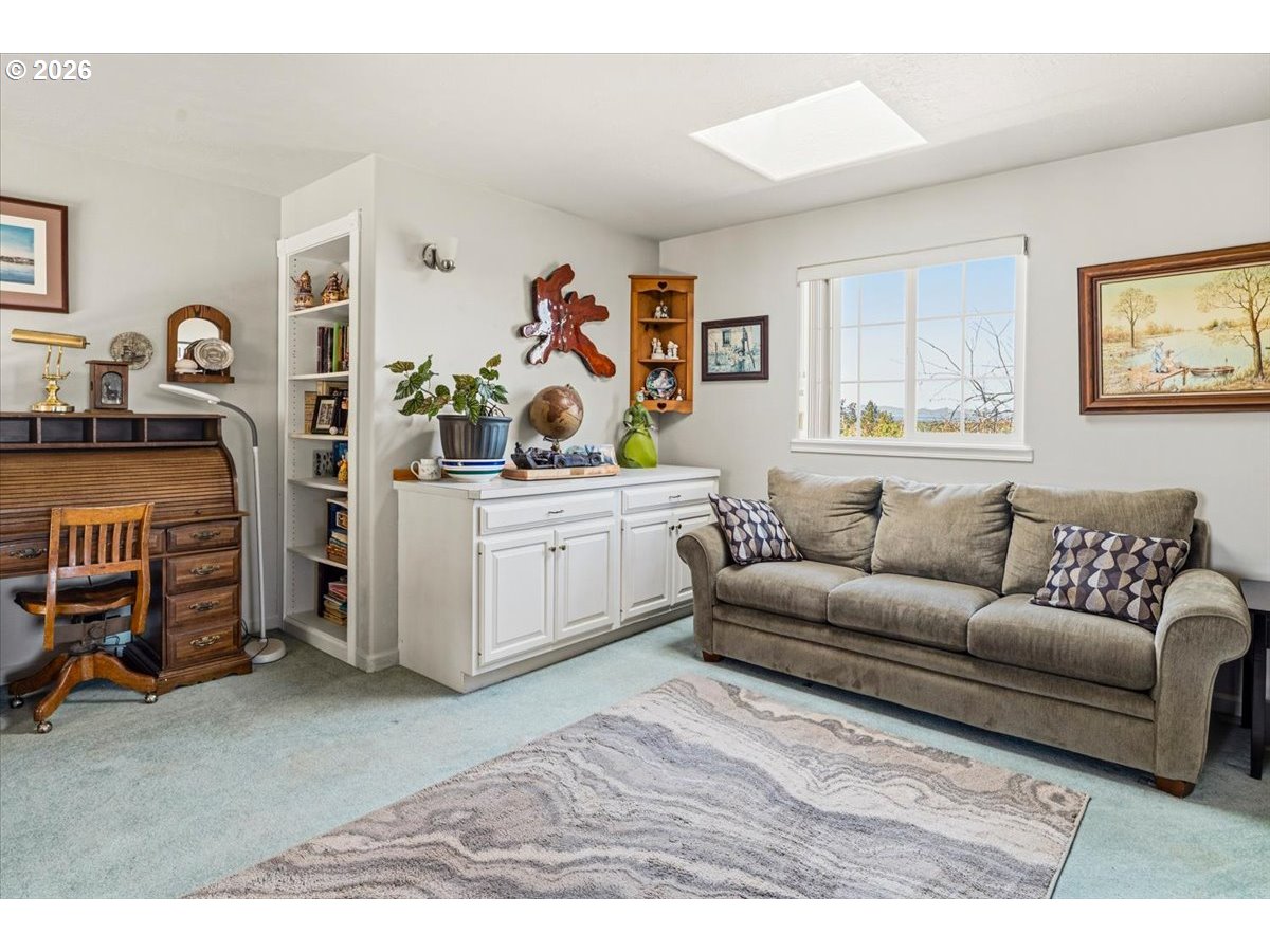 8818 Southwest Panorama Road Terrebonne, OR 97760 - Photo 24 of 46 a living room with furniture and a flat screen tv