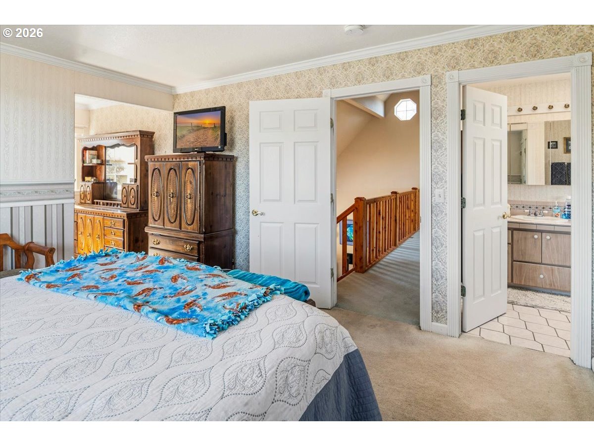 8818 Southwest Panorama Road Terrebonne, OR 97760 - Photo 26 of 46 a bedroom with a bed and a cabinets