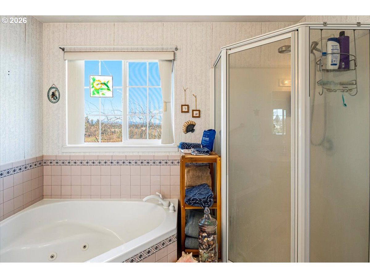8818 Southwest Panorama Road Terrebonne, OR 97760 - Photo 29 of 46 a bathroom with a bath tub and a shower