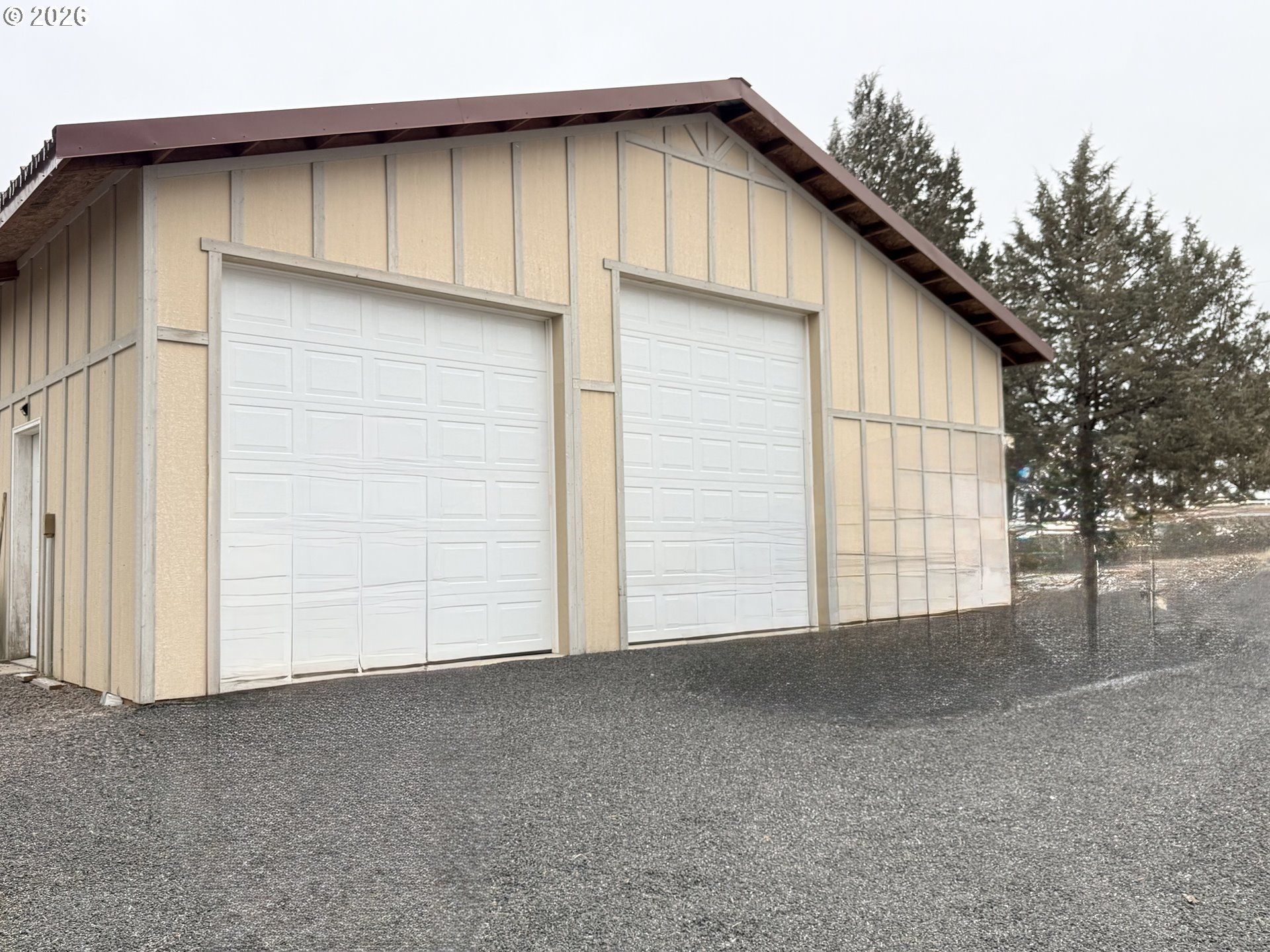 8818 Southwest Panorama Road Terrebonne, OR 97760 - Photo 4 of 46 a view of garage and wooden fence