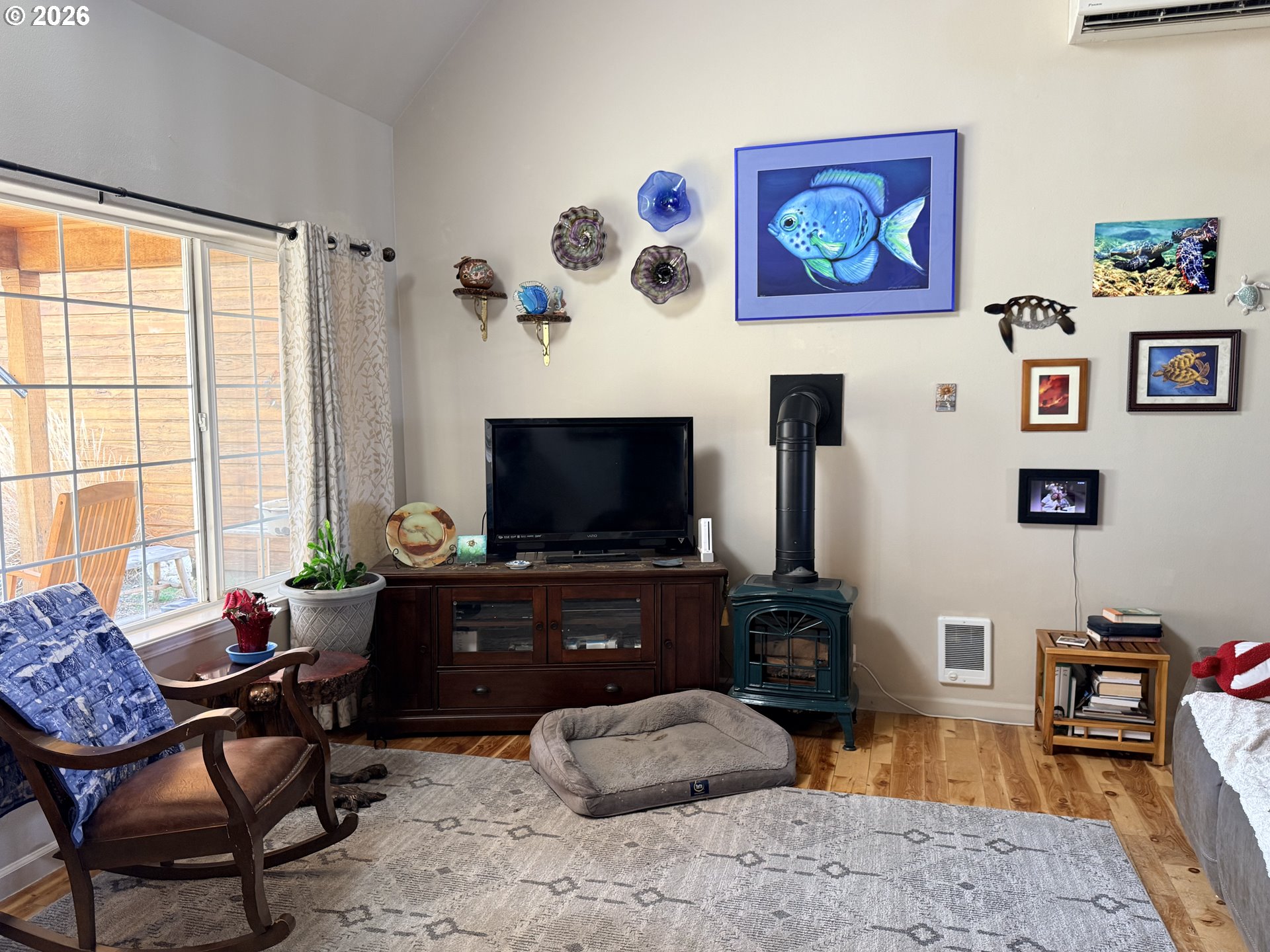 8818 Southwest Panorama Road Terrebonne, OR 97760 - Photo 5 of 46 a living room with furniture and a flat screen tv