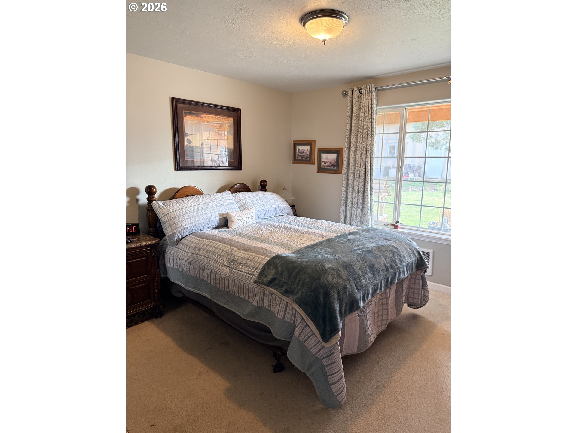 8818 Southwest Panorama Road Terrebonne, OR 97760 - Photo 9 of 46 a spacious bedroom with a bed and a window