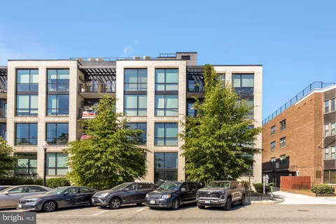 a view of a car parked in front of a building