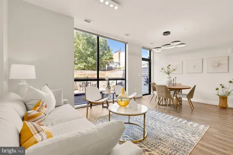 a roof deck view with a seating space