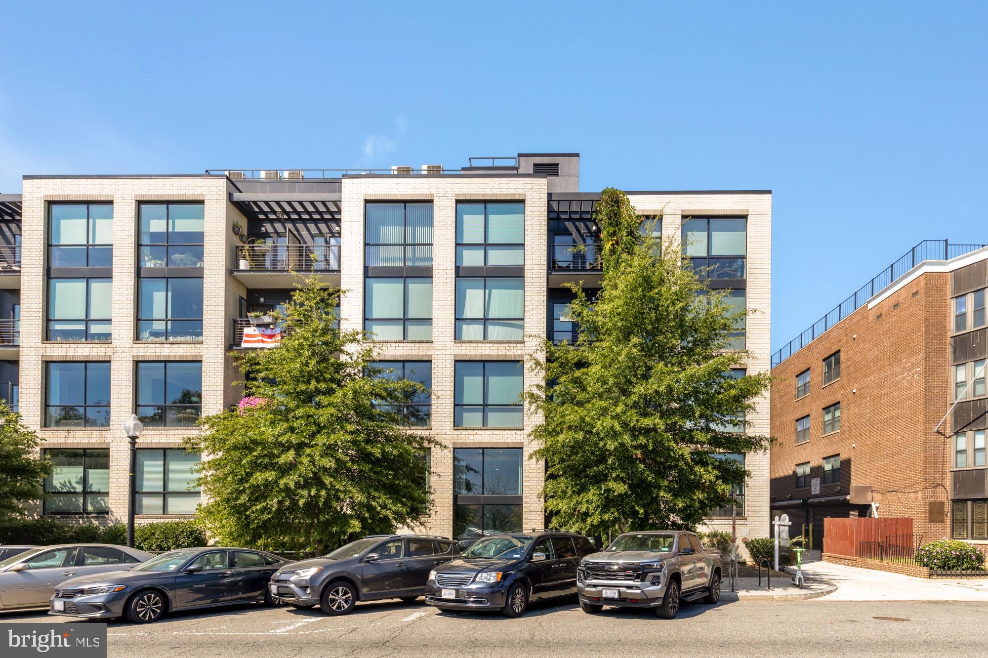 1628 11th Street Northwest, Unit 105 Washington, DC 20001 - Photo 2 of 55 a view of a car parked in front of a building