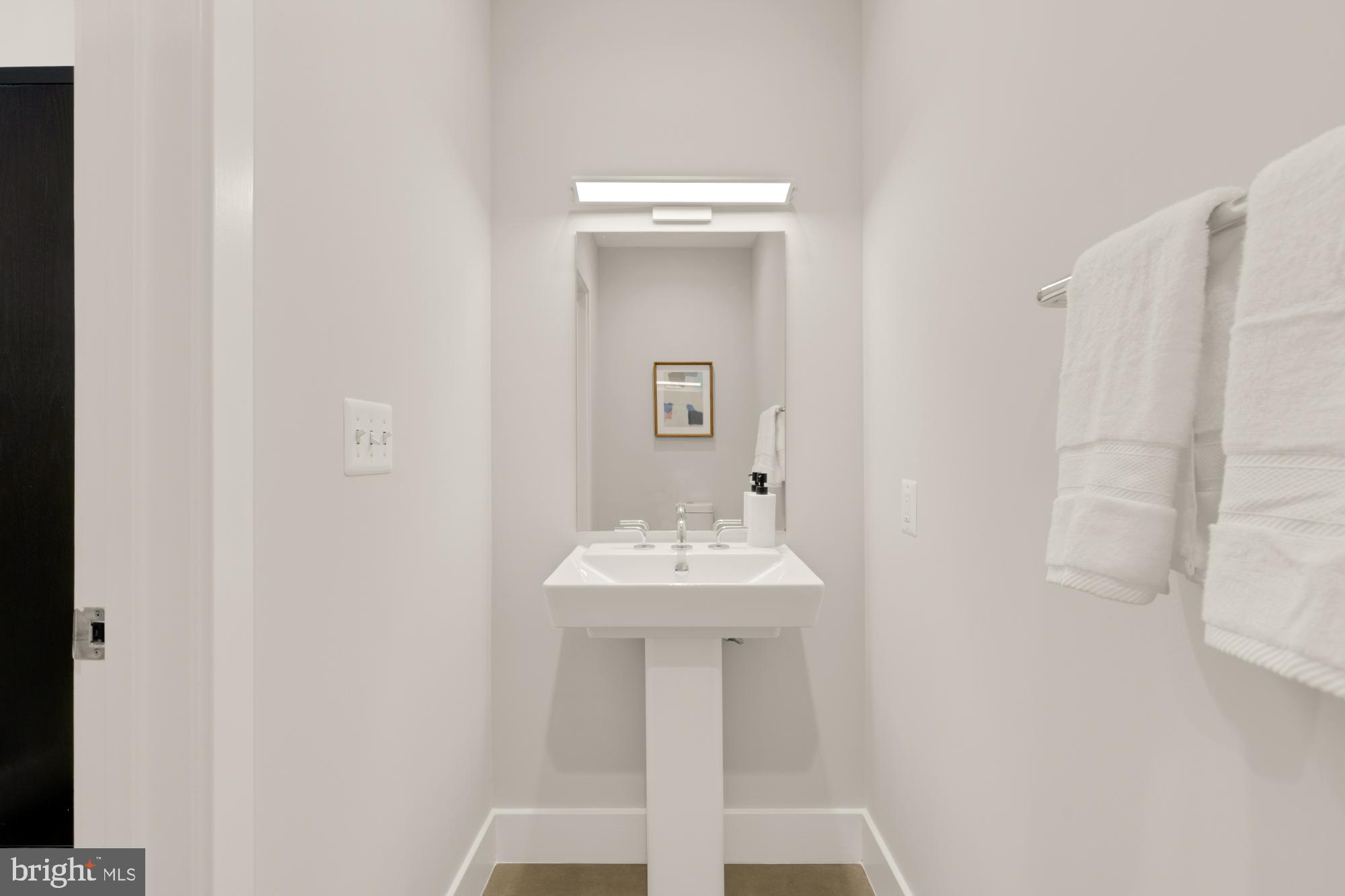 1628 11th Street Northwest, Unit 105 Washington, DC 20001 - Photo 23 of 55 a bathroom with a sink and a mirror