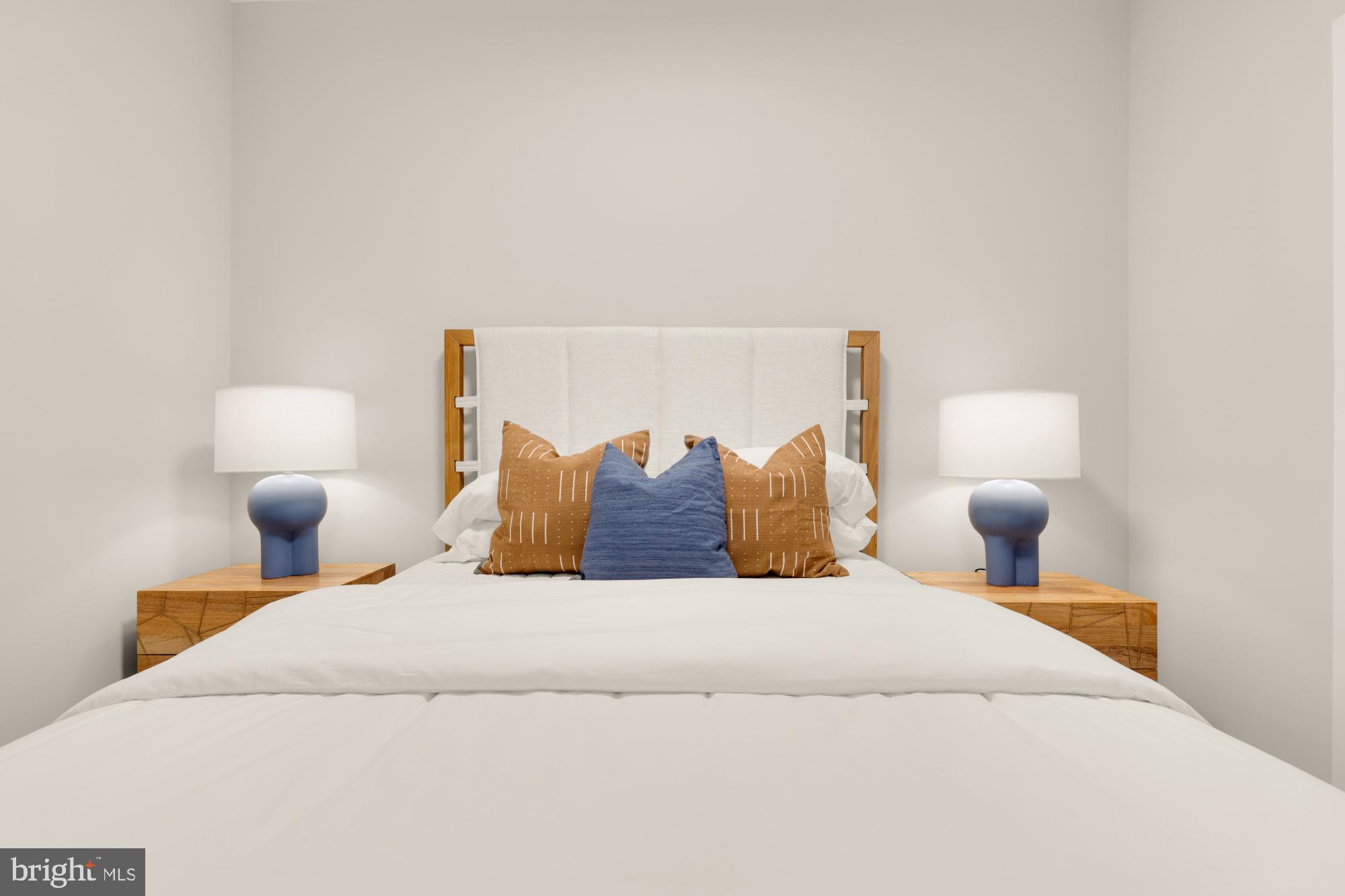 1628 11th Street Northwest, Unit 105 Washington, DC 20001 - Photo 33 of 55 a bedroom with a bed and a lamp