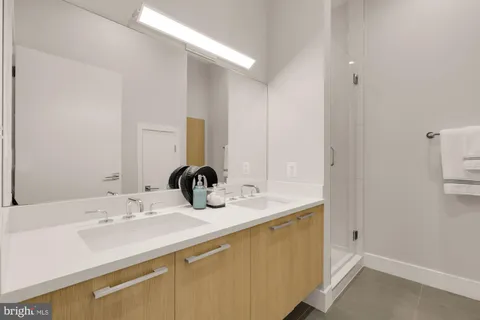 a large white bed in a white room