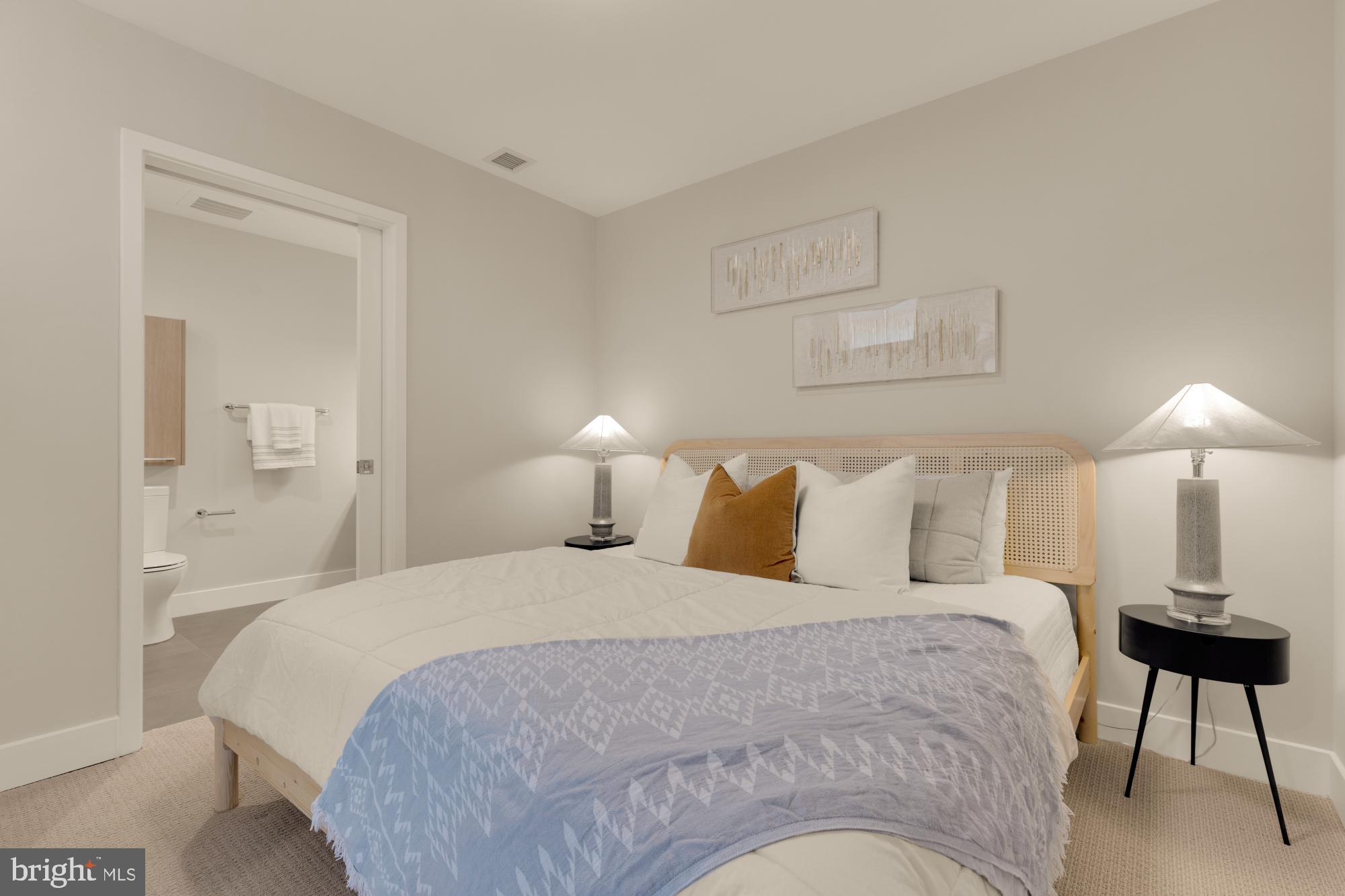 1628 11th Street Northwest, Unit 105 Washington, DC 20001 - Photo 39 of 55 a bedroom with a bed and a lamp