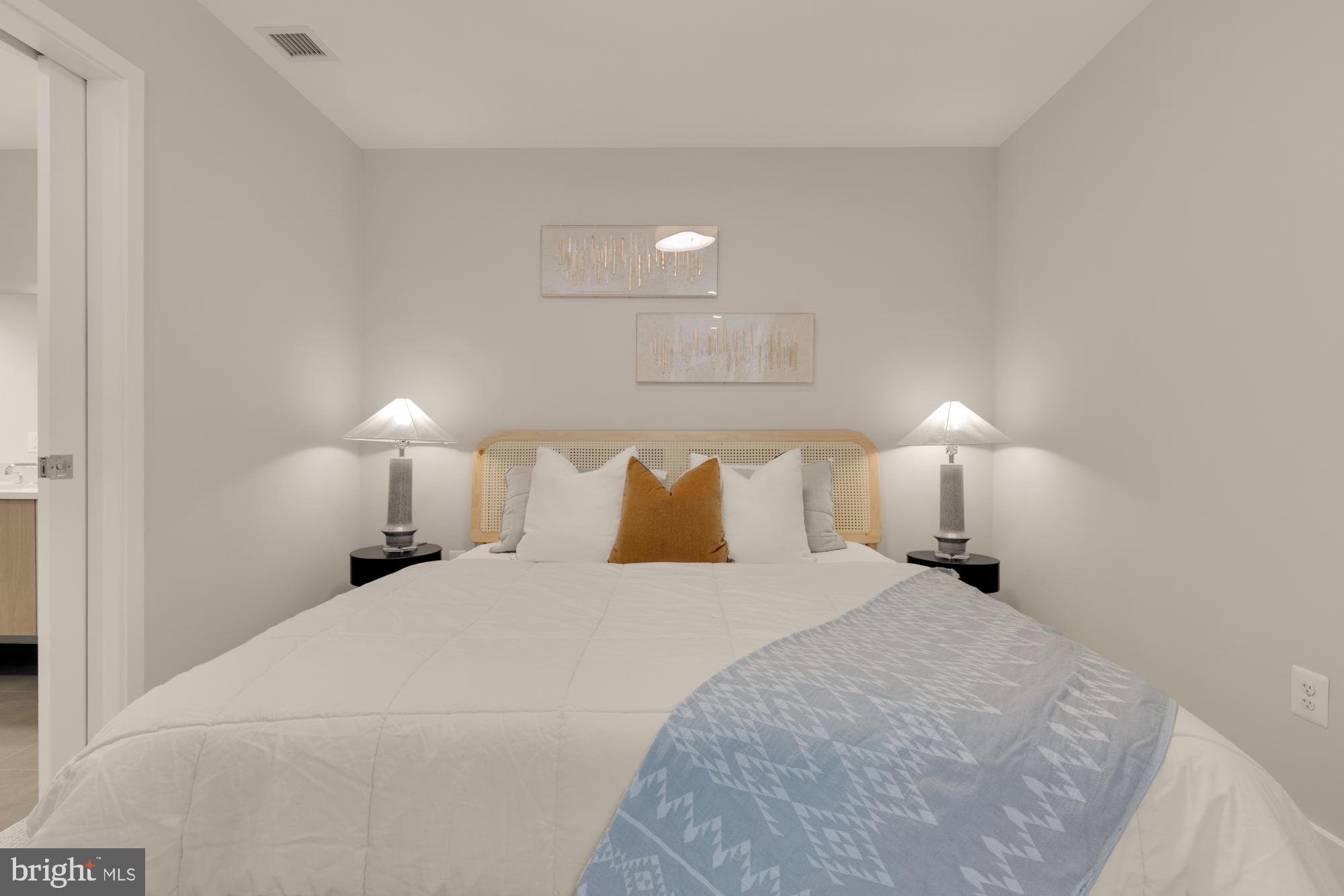 1628 11th Street Northwest, Unit 105 Washington, DC 20001 - Photo 40 of 55 a large white bed in a white room