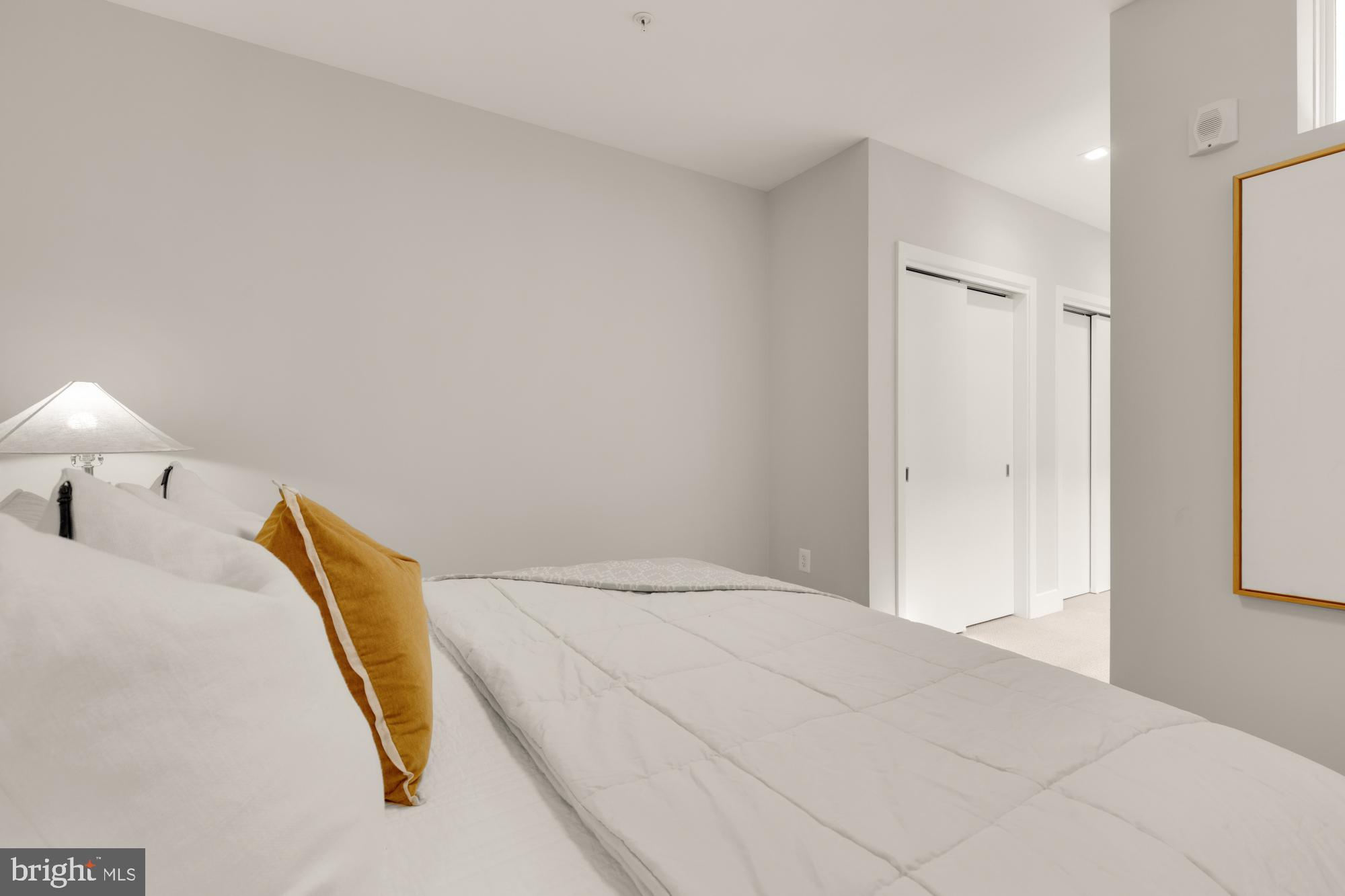 1628 11th Street Northwest, Unit 105 Washington, DC 20001 - Photo 41 of 55 a bedroom with a bed and a lamp