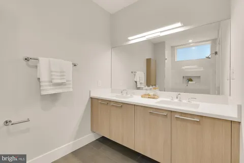 a bathroom with a shower and a sink