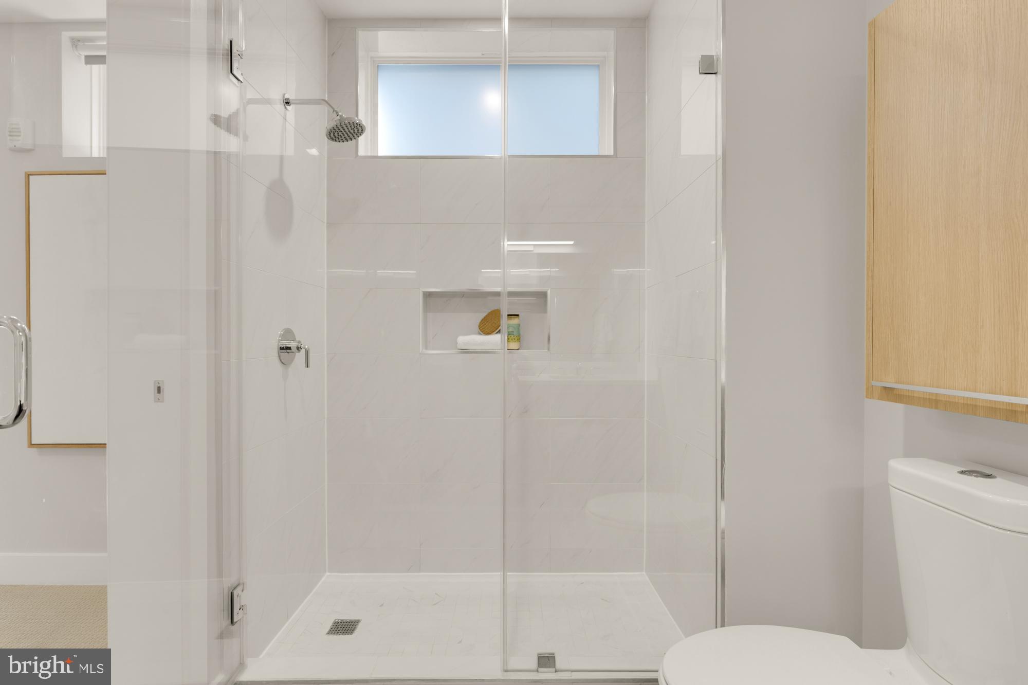 1628 11th Street Northwest, Unit 105 Washington, DC 20001 - Photo 43 of 55 a bathroom with a shower and toilet
