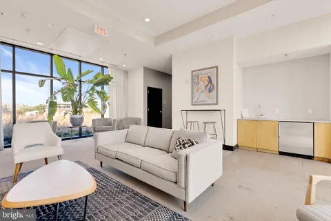 a view of a lobby with chair and tables