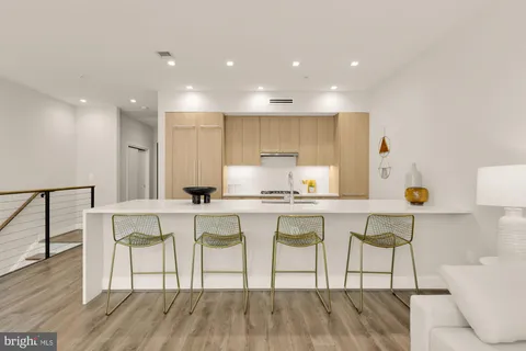 a kitchen with granite countertop a stove and a sink