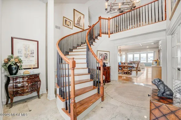 a large kitchen with stainless steel appliances granite countertop a lot of counter space and a sink