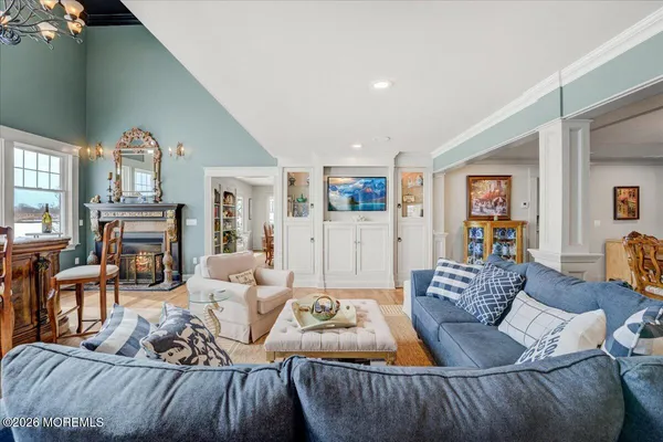 a very nice looking room with a large window and chandelier