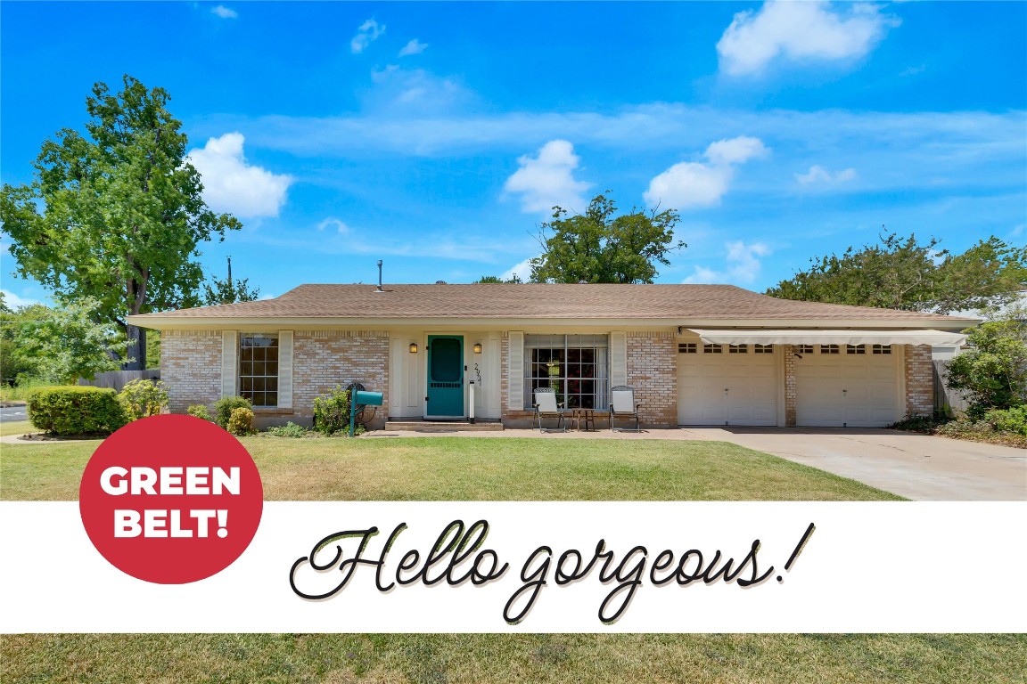 a view of a house with a backyard