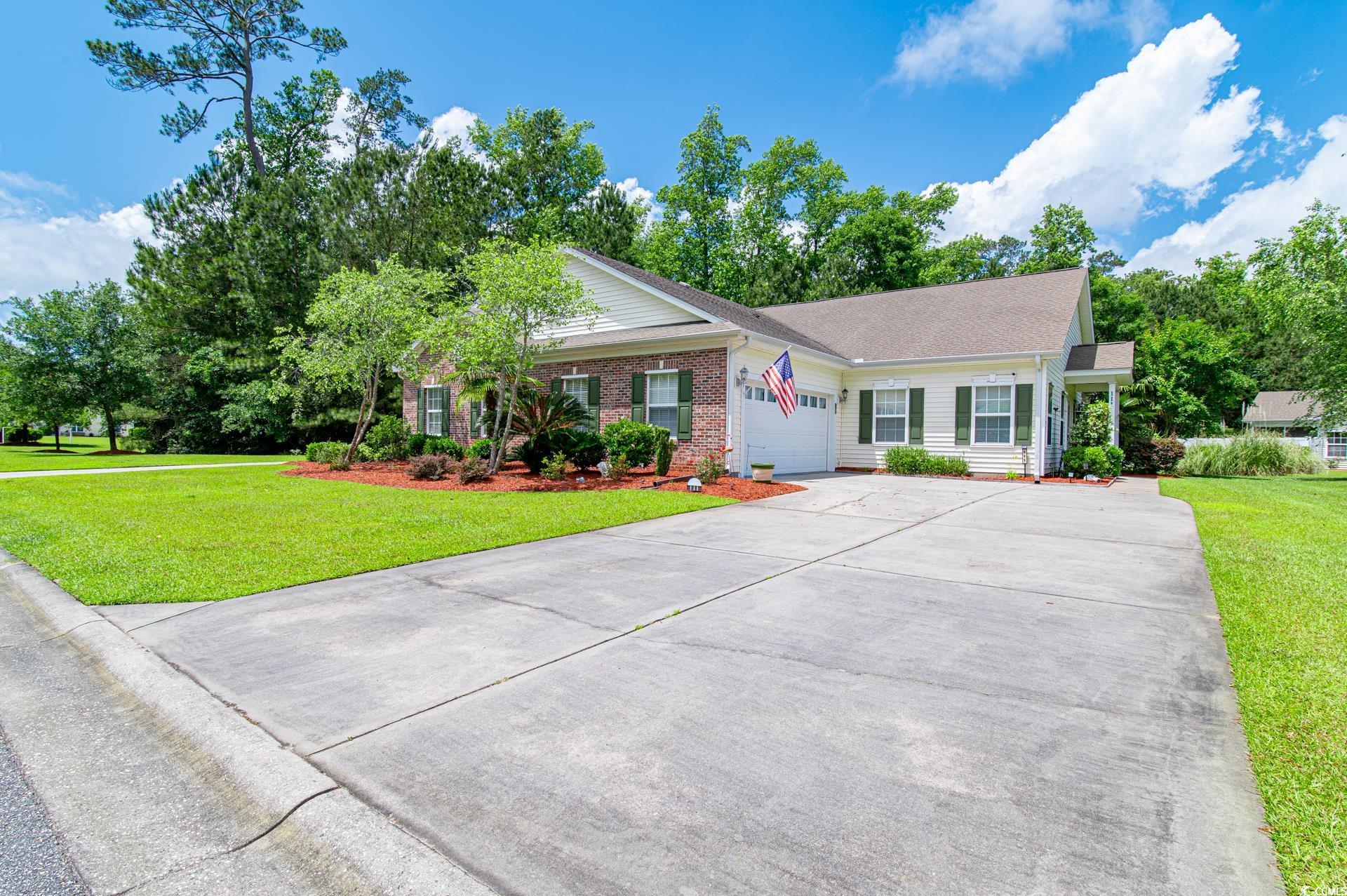 111 Rose Water Loop Myrtle Beach, SC 29588 - Photo 1 of 39 Ranch-style house featuring a garage, driveway, a