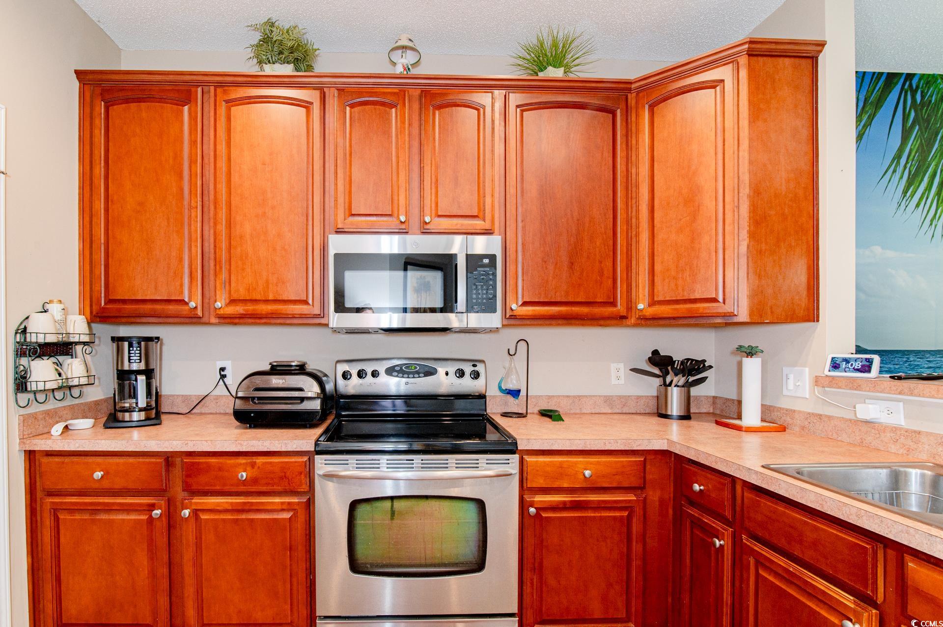 111 Rose Water Loop Myrtle Beach, SC 29588 - Photo 19 of 39 Kitchen with stainless steel appliances, light cou