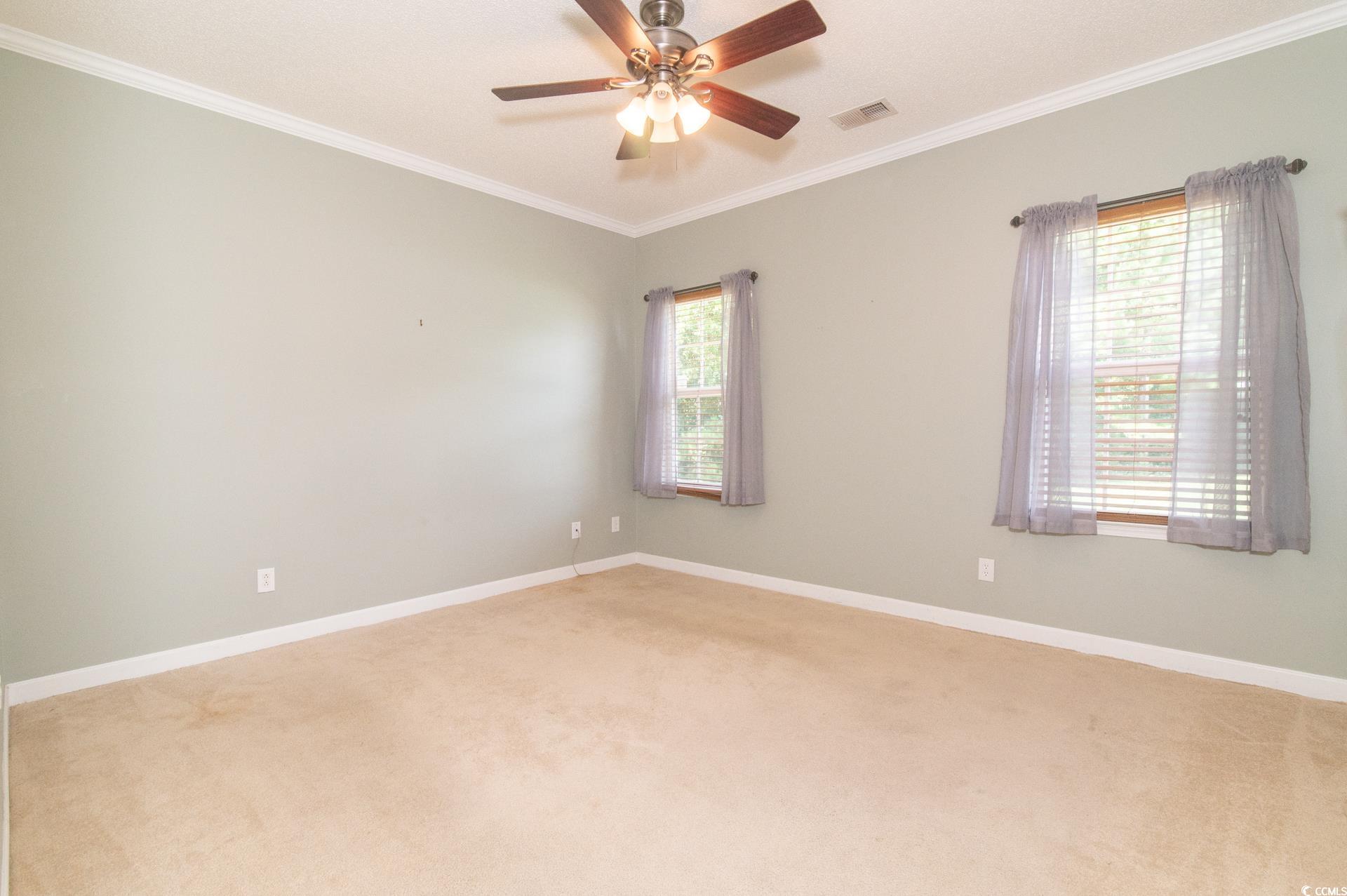 111 Rose Water Loop Myrtle Beach, SC 29588 - Photo 22 of 39 Spare room featuring ornamental molding, light car