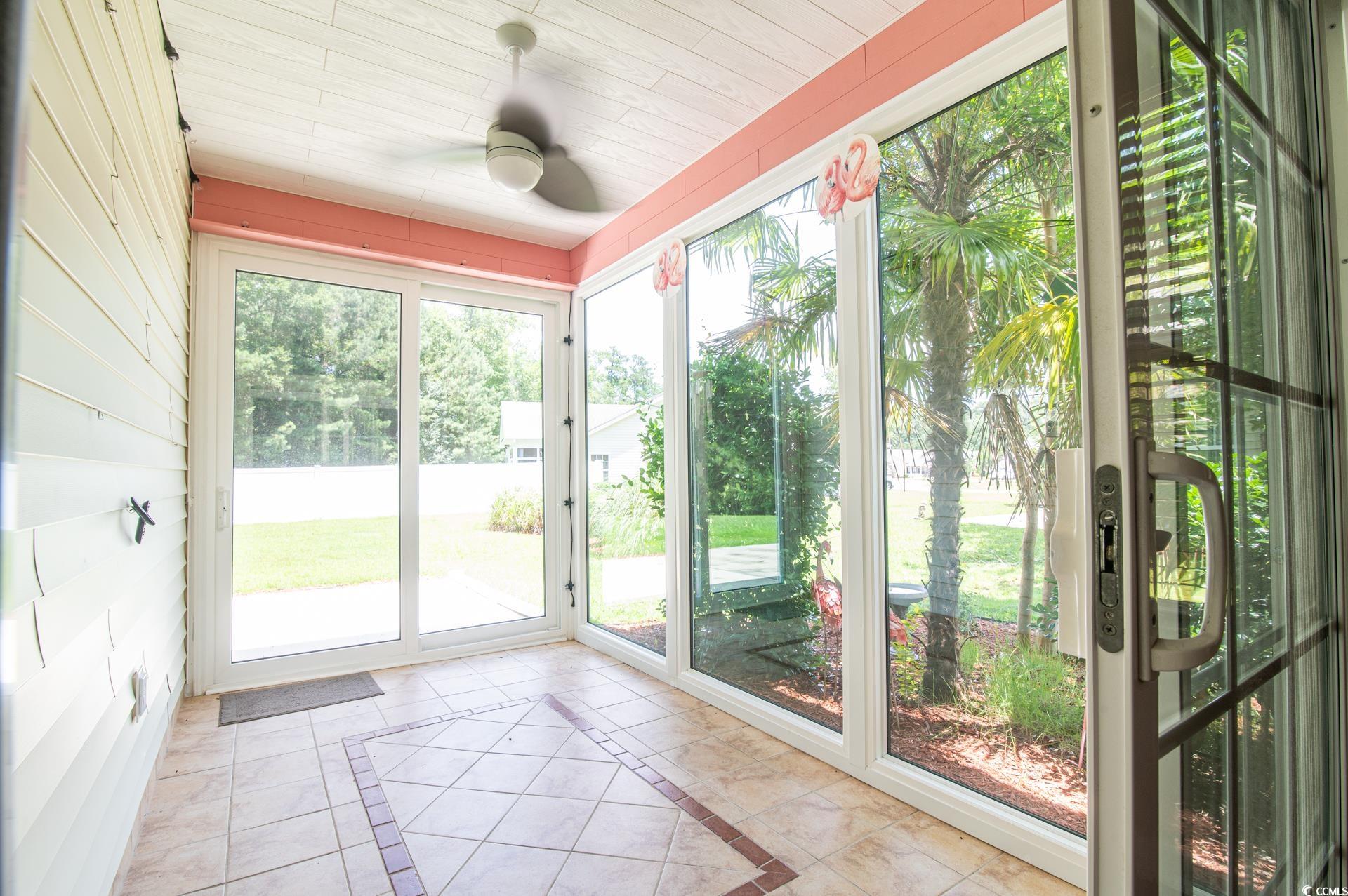 111 Rose Water Loop Myrtle Beach, SC 29588 - Photo 31 of 39 Unfurnished sunroom featuring plenty of natural li