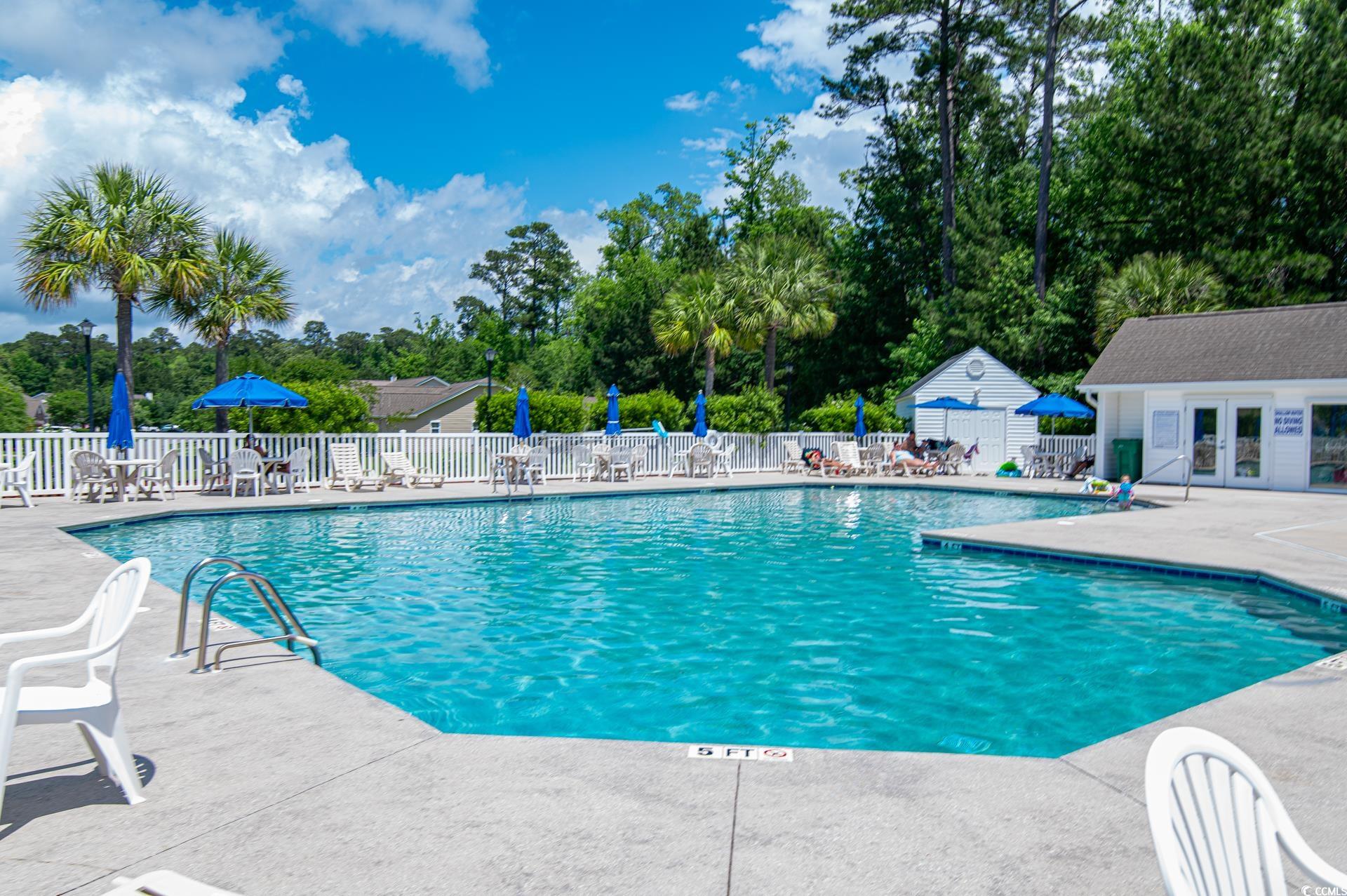 111 Rose Water Loop Myrtle Beach, SC 29588 - Photo 32 of 39 Community pool featuring fence, a patio area, fren
