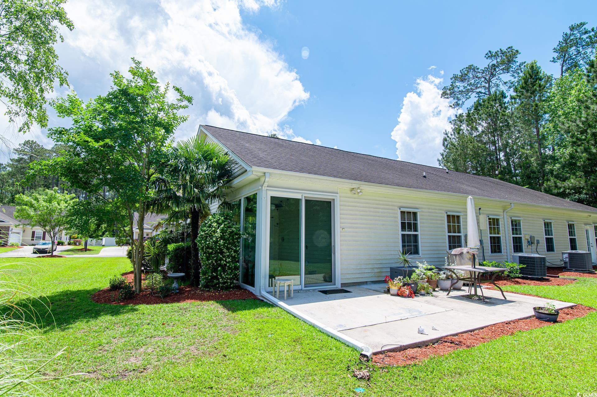 111 Rose Water Loop Myrtle Beach, SC 29588 - Photo 4 of 39 Back of house with a patio area, central AC, and a