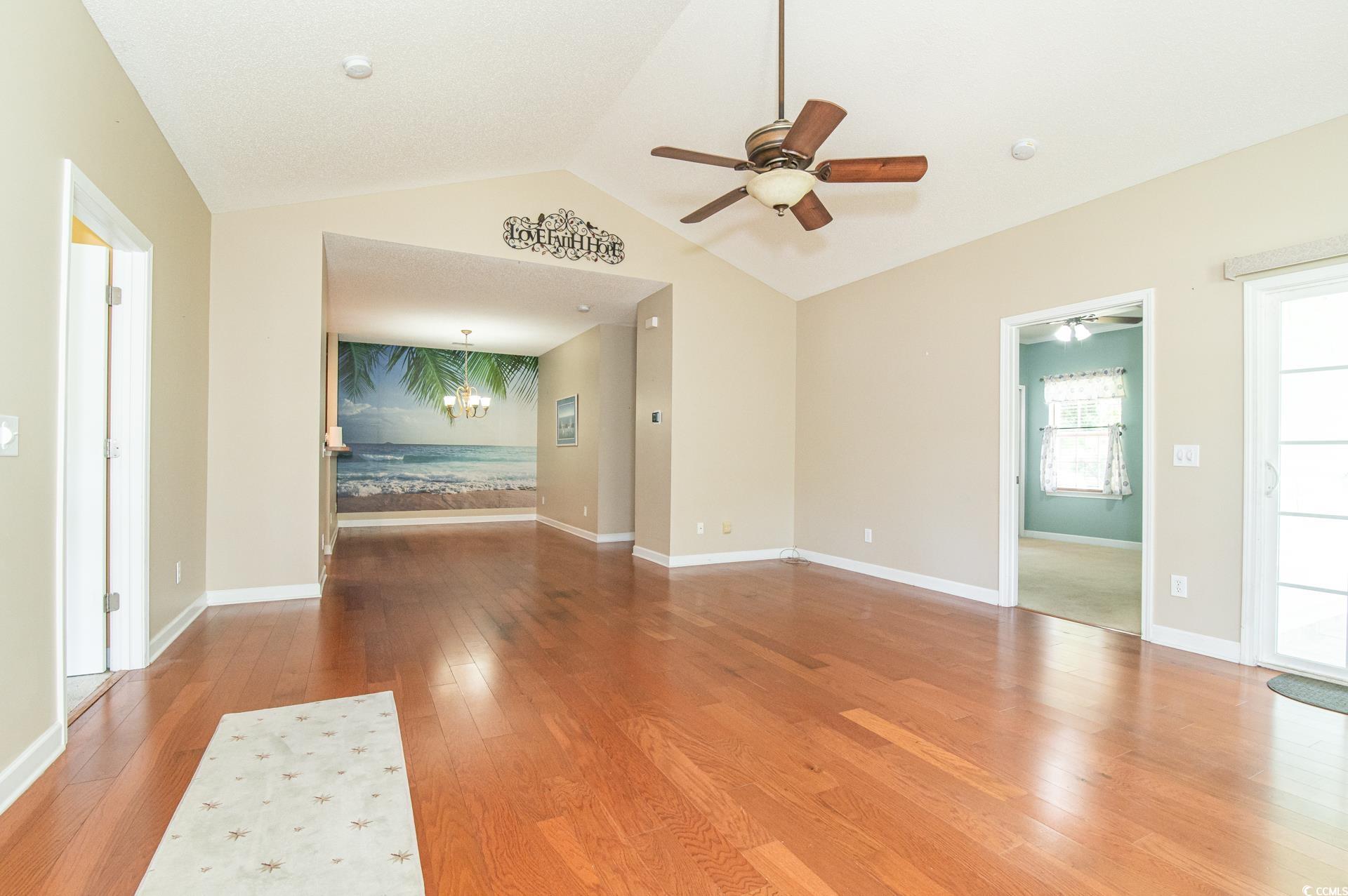 111 Rose Water Loop Myrtle Beach, SC 29588 - Photo 6 of 39 Unfurnished living room featuring ceiling fan, har
