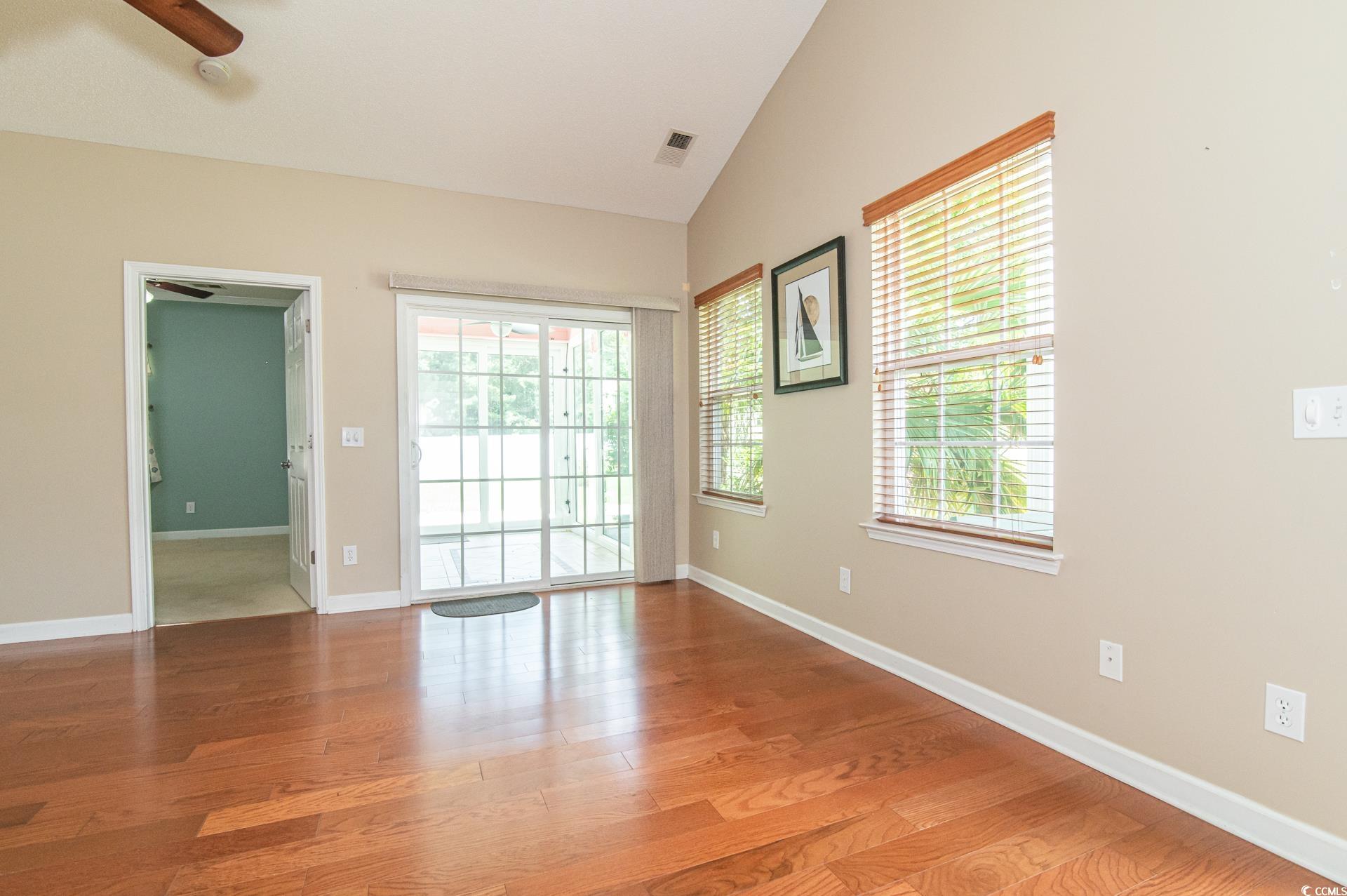 111 Rose Water Loop Myrtle Beach, SC 29588 - Photo 8 of 39 Empty room featuring wood finished floors, healthy