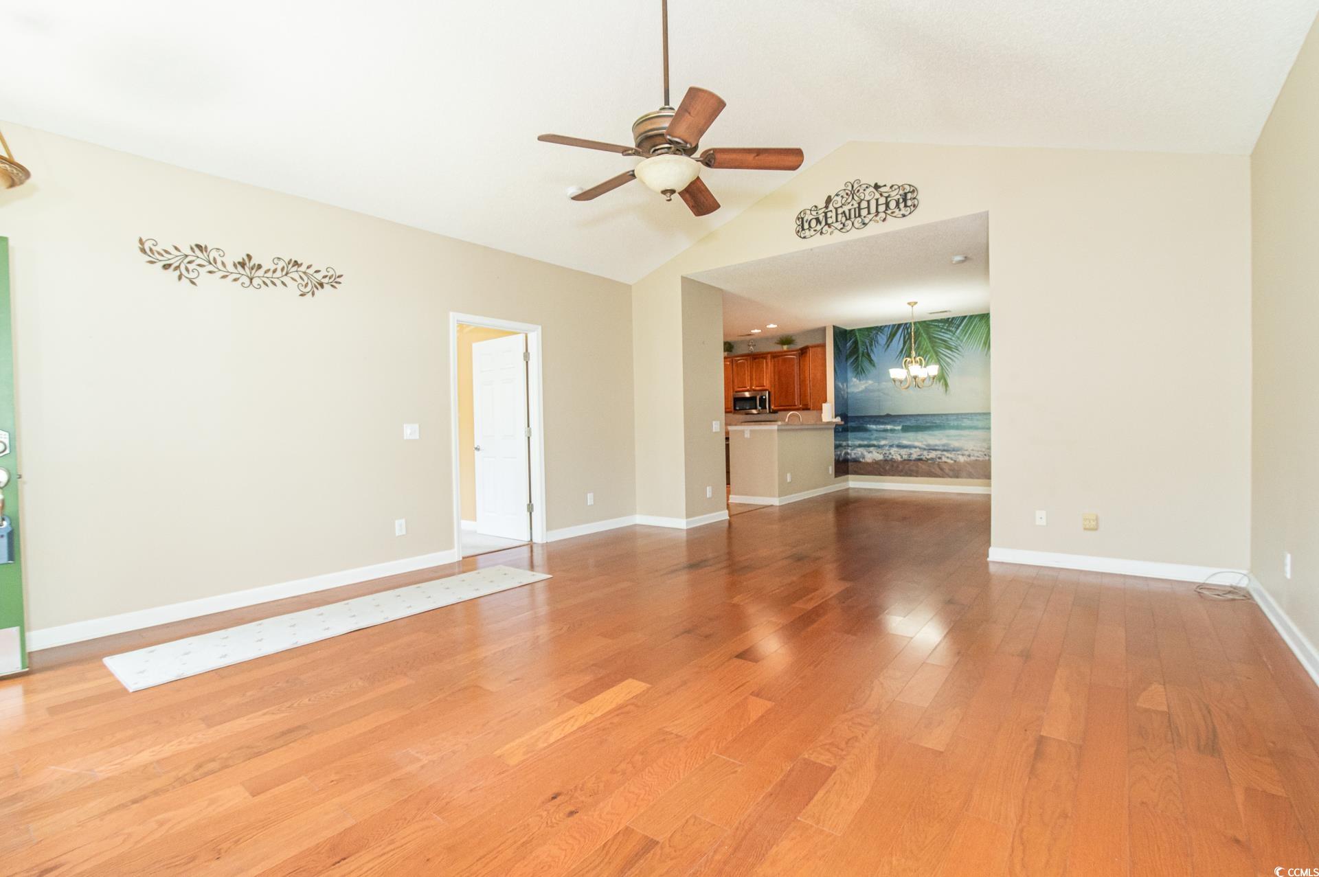 111 Rose Water Loop Myrtle Beach, SC 29588 - Photo 9 of 39 Unfurnished living room with a ceiling fan, light