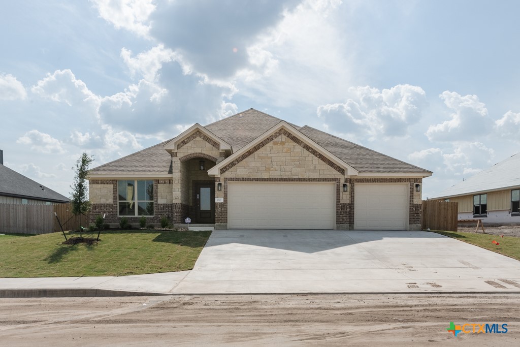 1317 Red Rock Road Lorena, TX 76655 - Photo 1 of 1 a front view of a house with a yard and garage