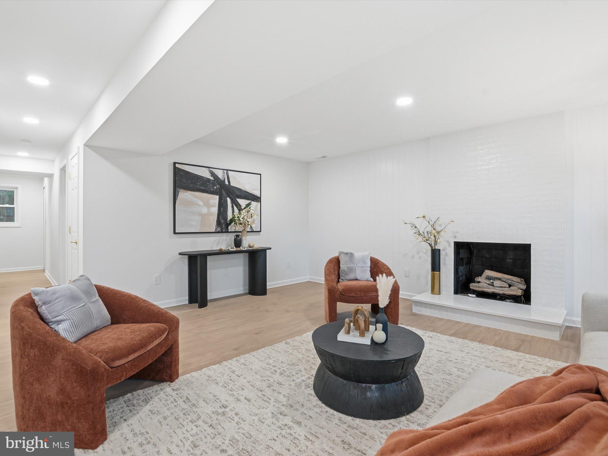 2133 Freda Drive Vienna, VA 22181 - Photo 15 of 45 a living room with furniture and a fireplace