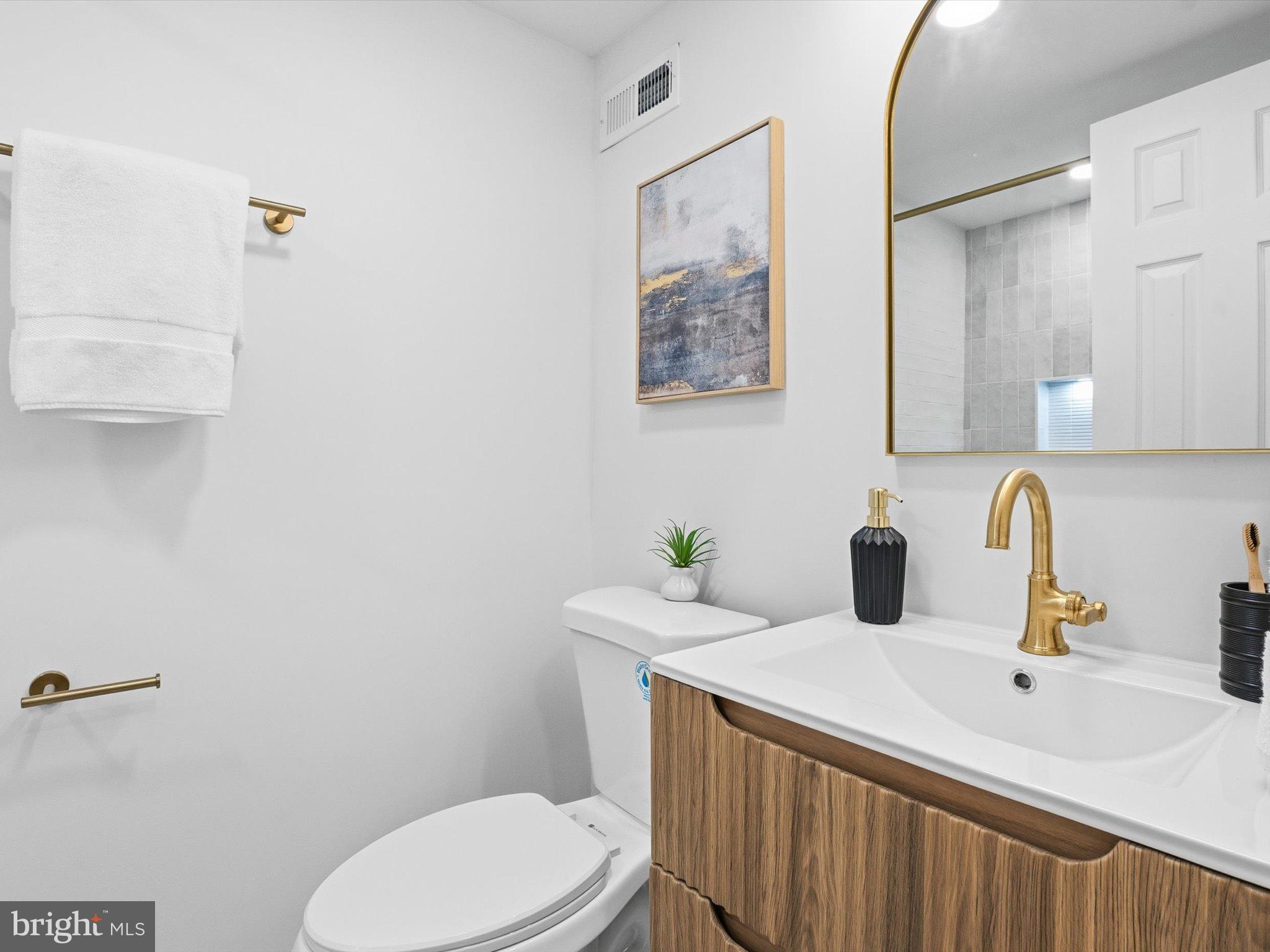 2133 Freda Drive Vienna, VA 22181 - Photo 18 of 45 a bathroom with a sink a toilet and mirror