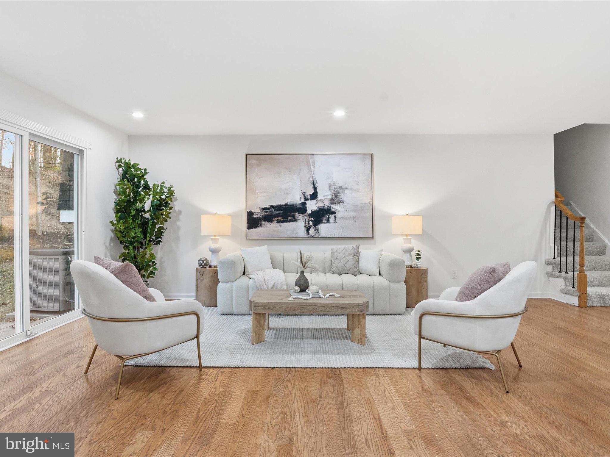 2133 Freda Drive Vienna, VA 22181 - Photo 2 of 45 a living room with furniture and a potted plant