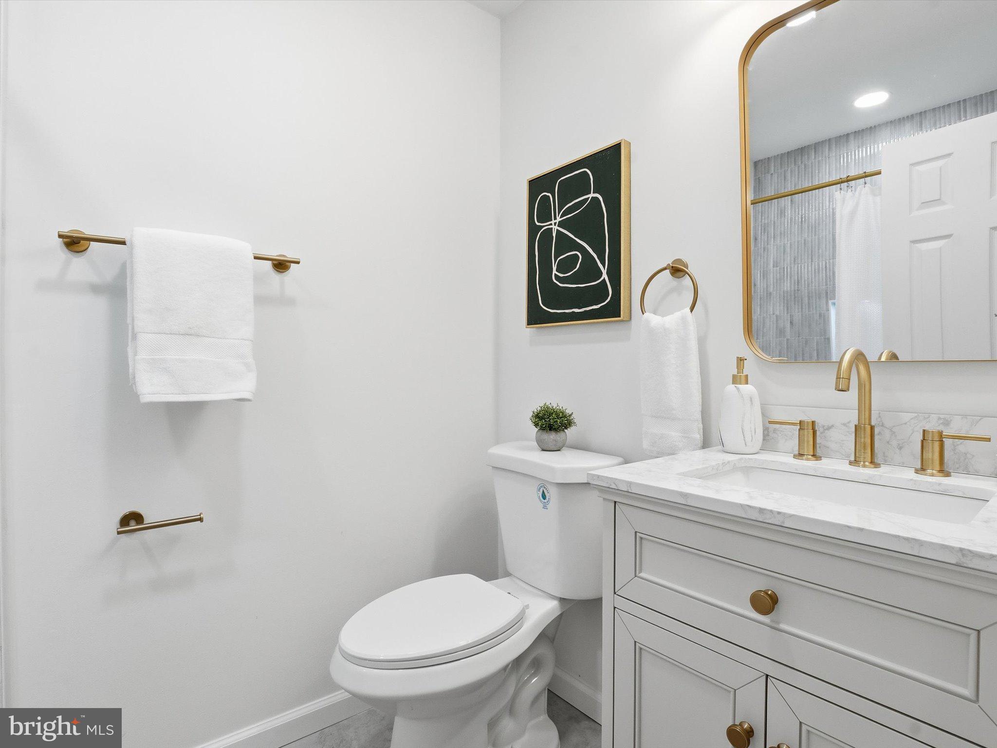 2133 Freda Drive Vienna, VA 22181 - Photo 26 of 45 a bathroom with a toilet sink and mirror