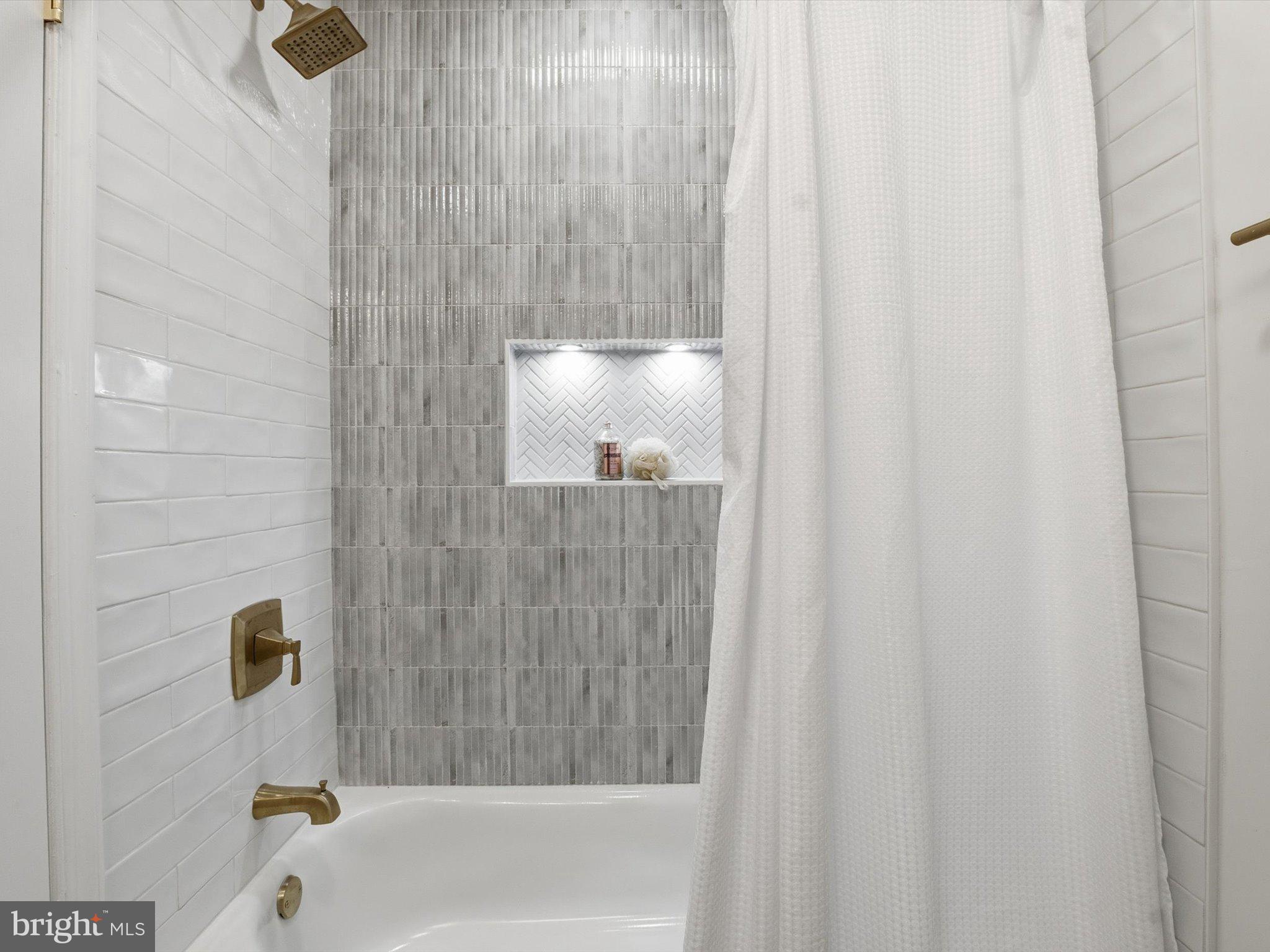 2133 Freda Drive Vienna, VA 22181 - Photo 27 of 45 a bathroom with a shower and a tub