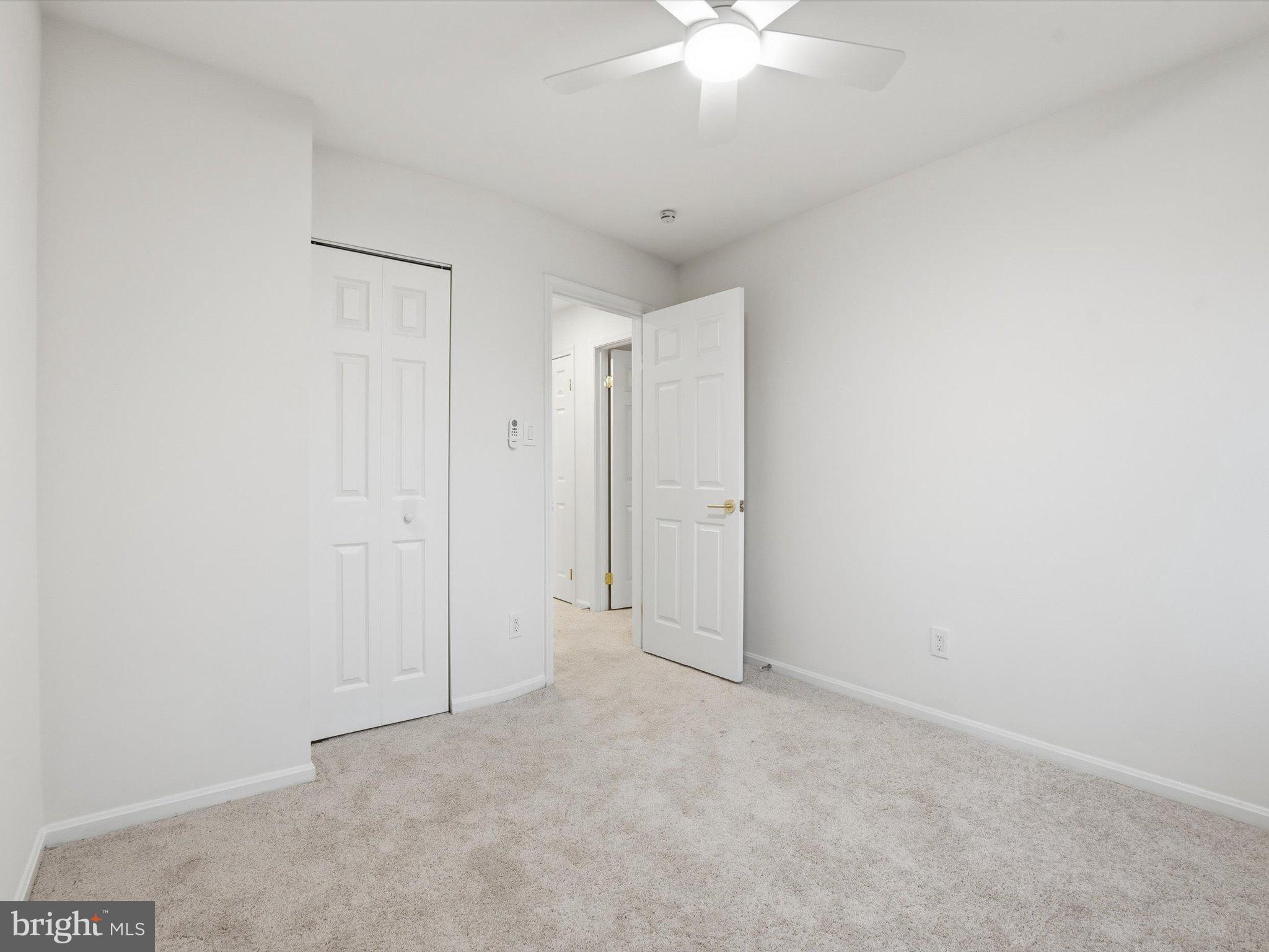 2133 Freda Drive Vienna, VA 22181 - Photo 30 of 45 an empty room with a chandelier fan