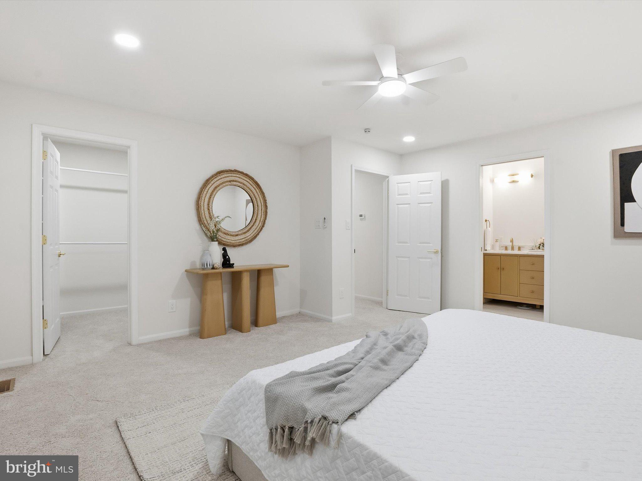 2133 Freda Drive Vienna, VA 22181 - Photo 32 of 45 a bedroom with a bed and a chandelier