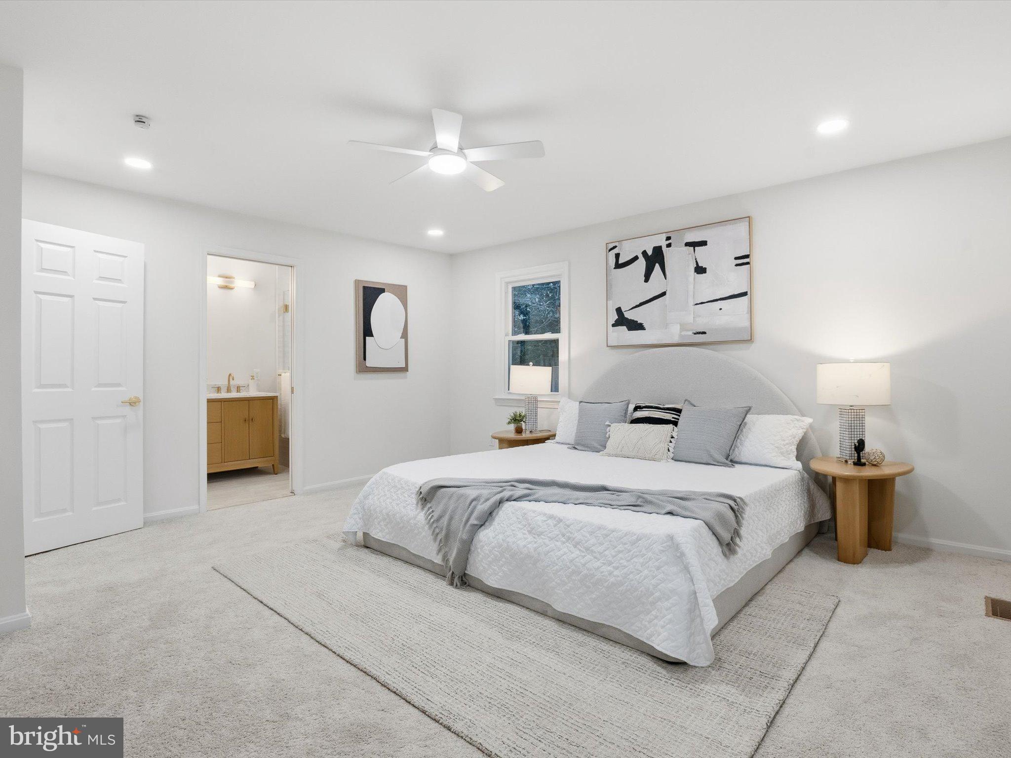 2133 Freda Drive Vienna, VA 22181 - Photo 33 of 45 a bedroom with a bed and lamp