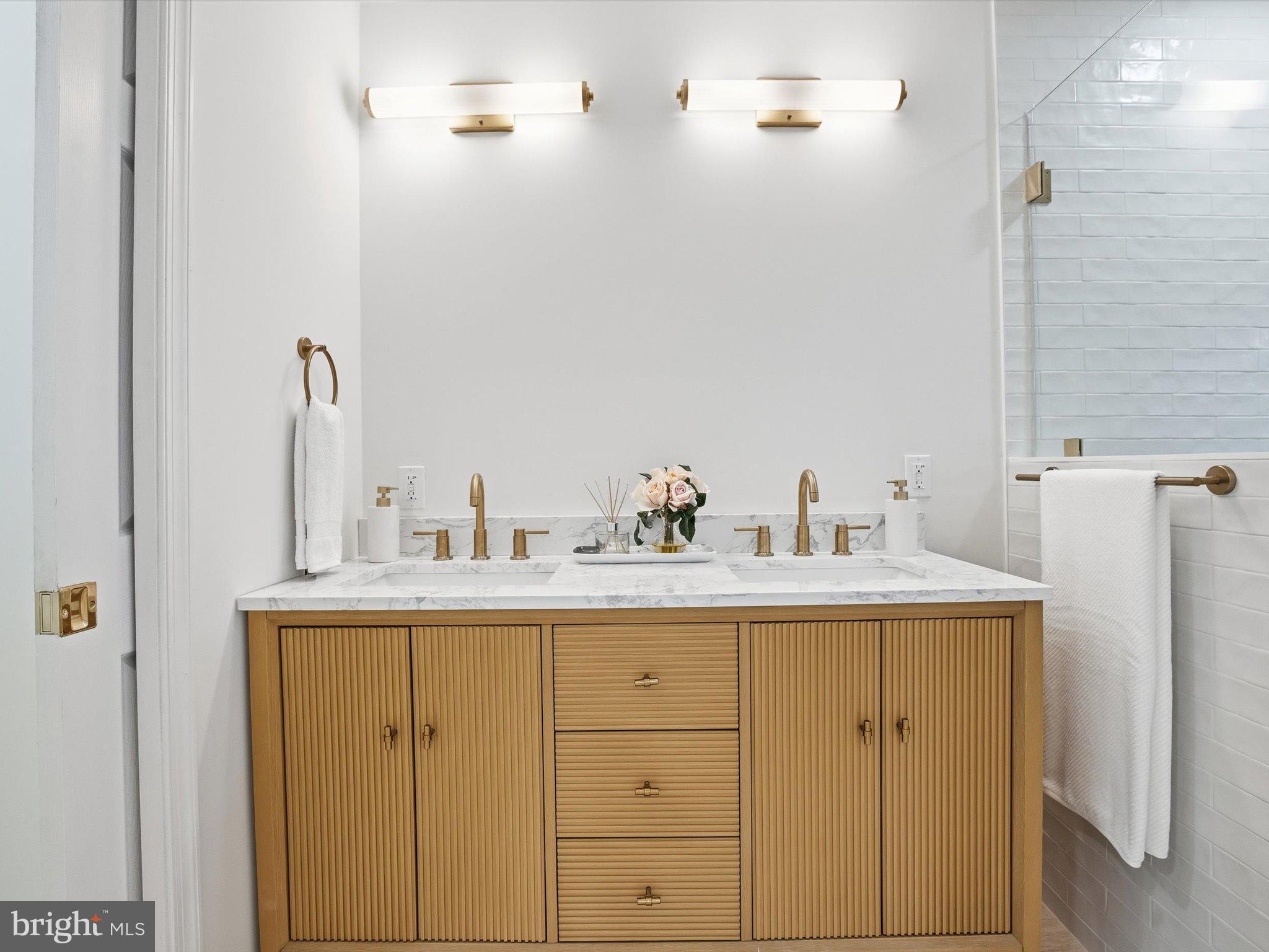 2133 Freda Drive Vienna, VA 22181 - Photo 35 of 45 a bathroom with a sink and a mirror