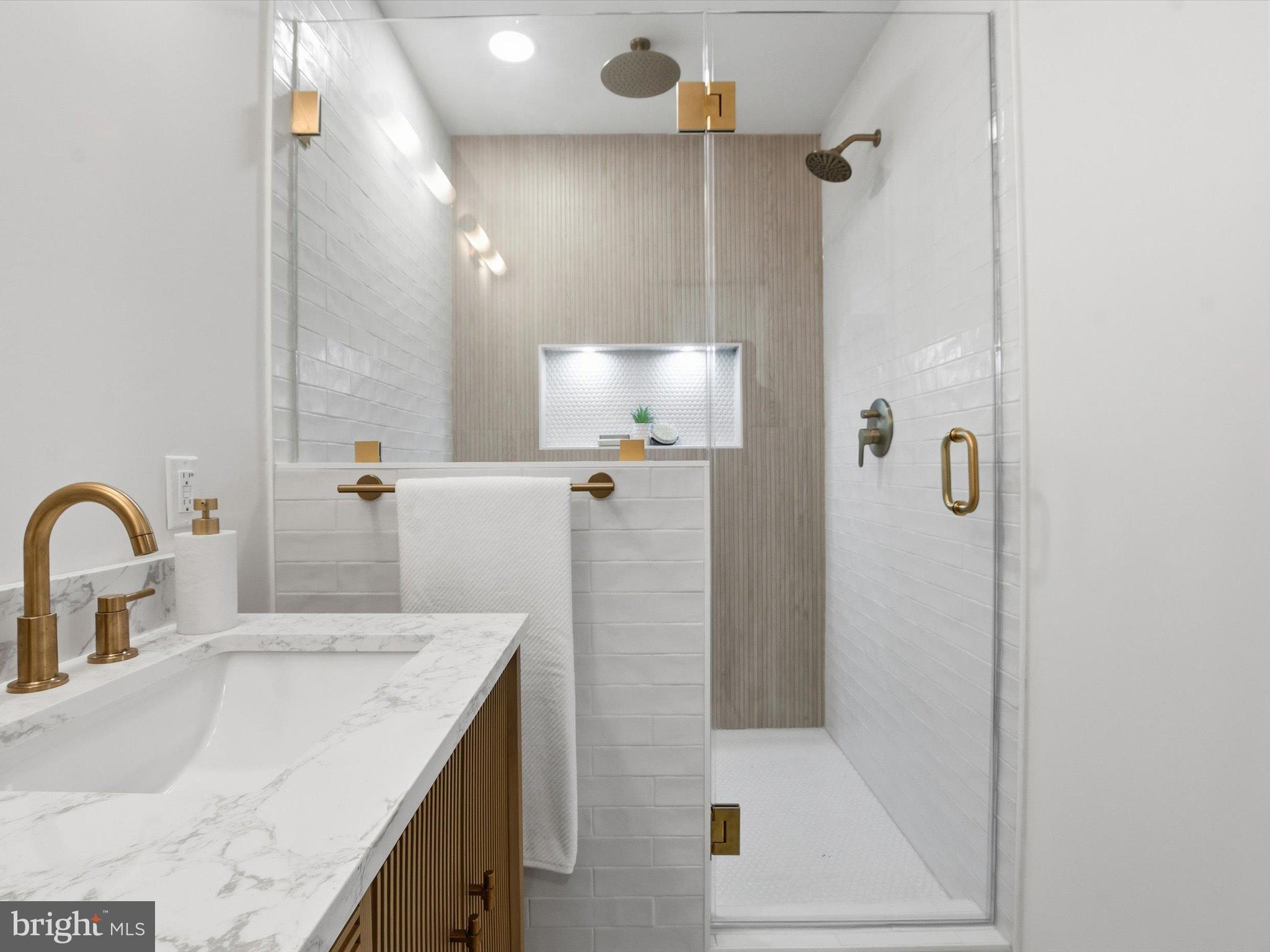 2133 Freda Drive Vienna, VA 22181 - Photo 36 of 45 a bathroom with a granite countertop shower a sink and toilet