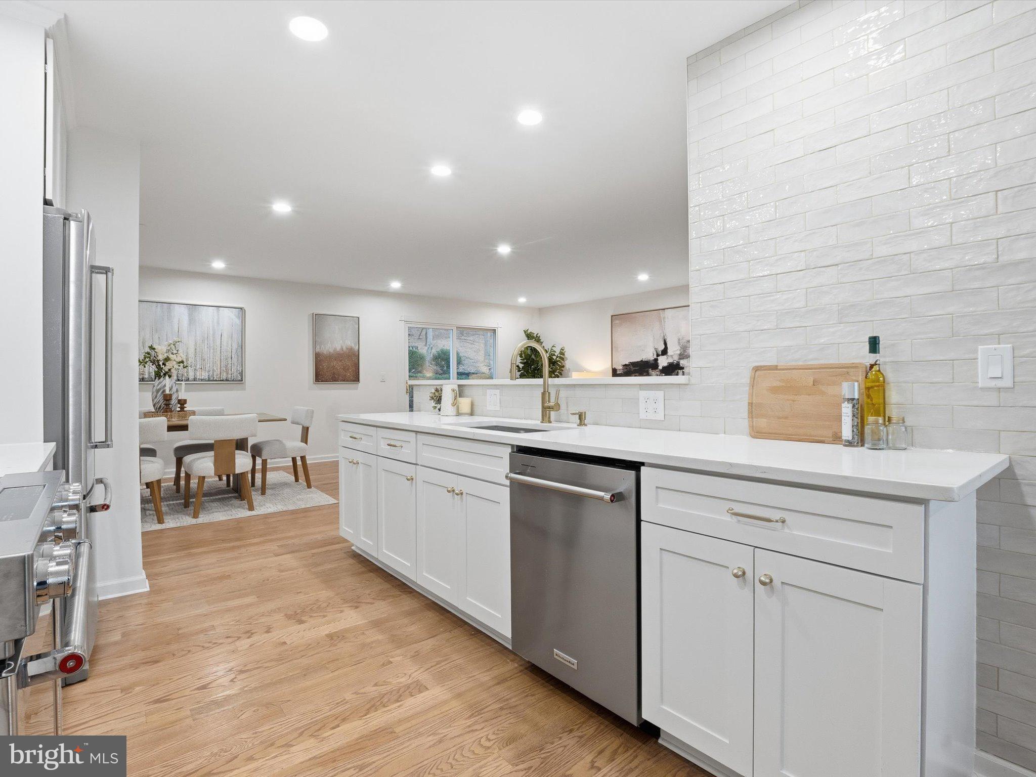 2133 Freda Drive Vienna, VA 22181 - Photo 7 of 45 a kitchen with white cabinets and sink