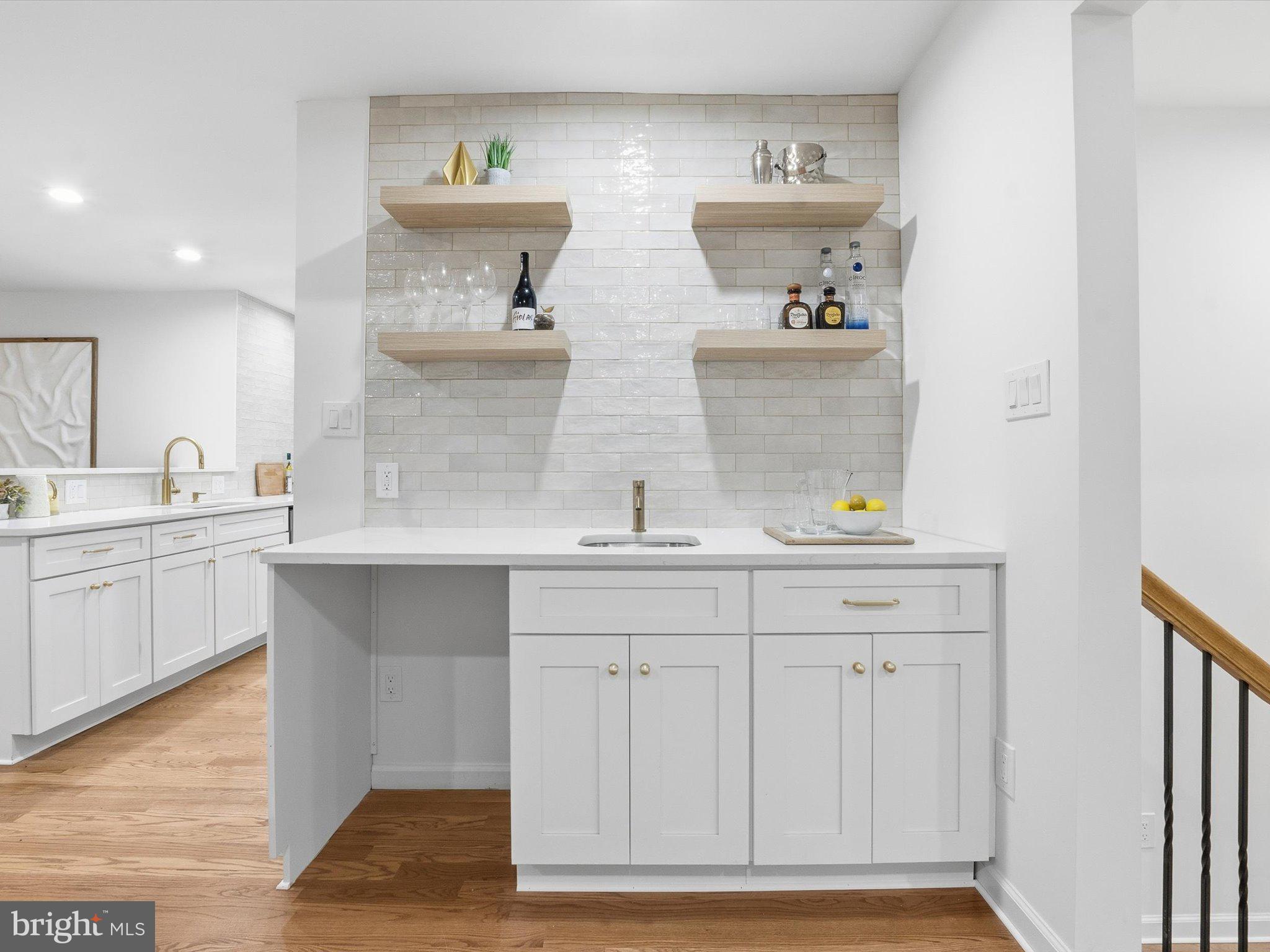 2133 Freda Drive Vienna, VA 22181 - Photo 10 of 45 a kitchen with white cabinets and sink