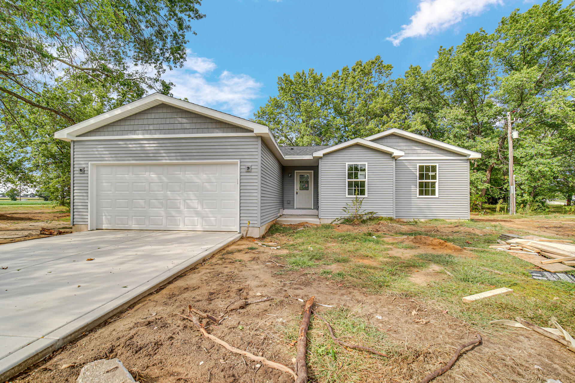a view of front of house with a yard